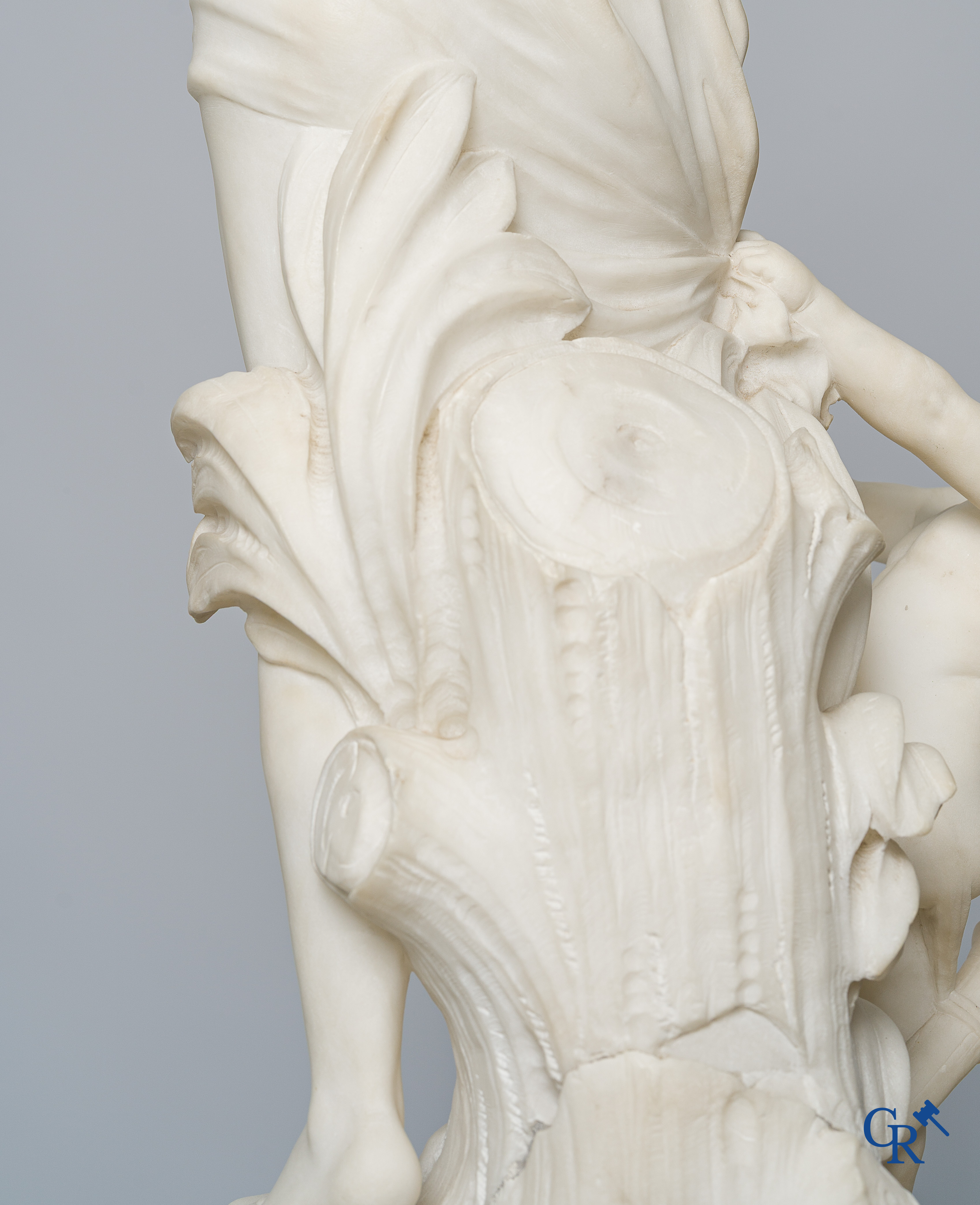 Cipriani. Romantic representation in sculpted marble. Young lady with cupid. LXVI style pedestal. Circa 1900.