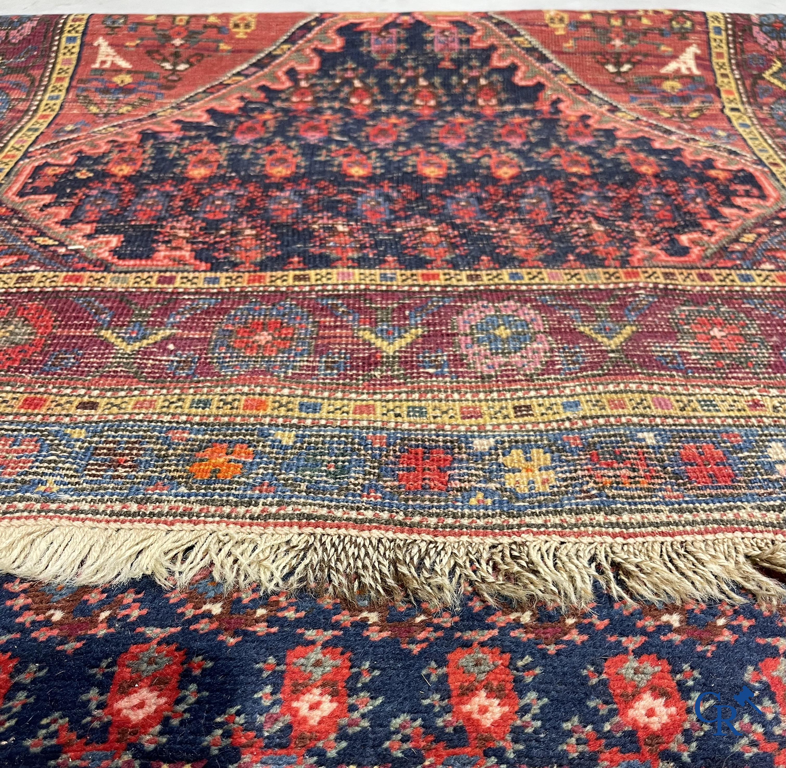 Oriental carpets. A large hand-knotted antique runner with geometric motifs. 19th century.