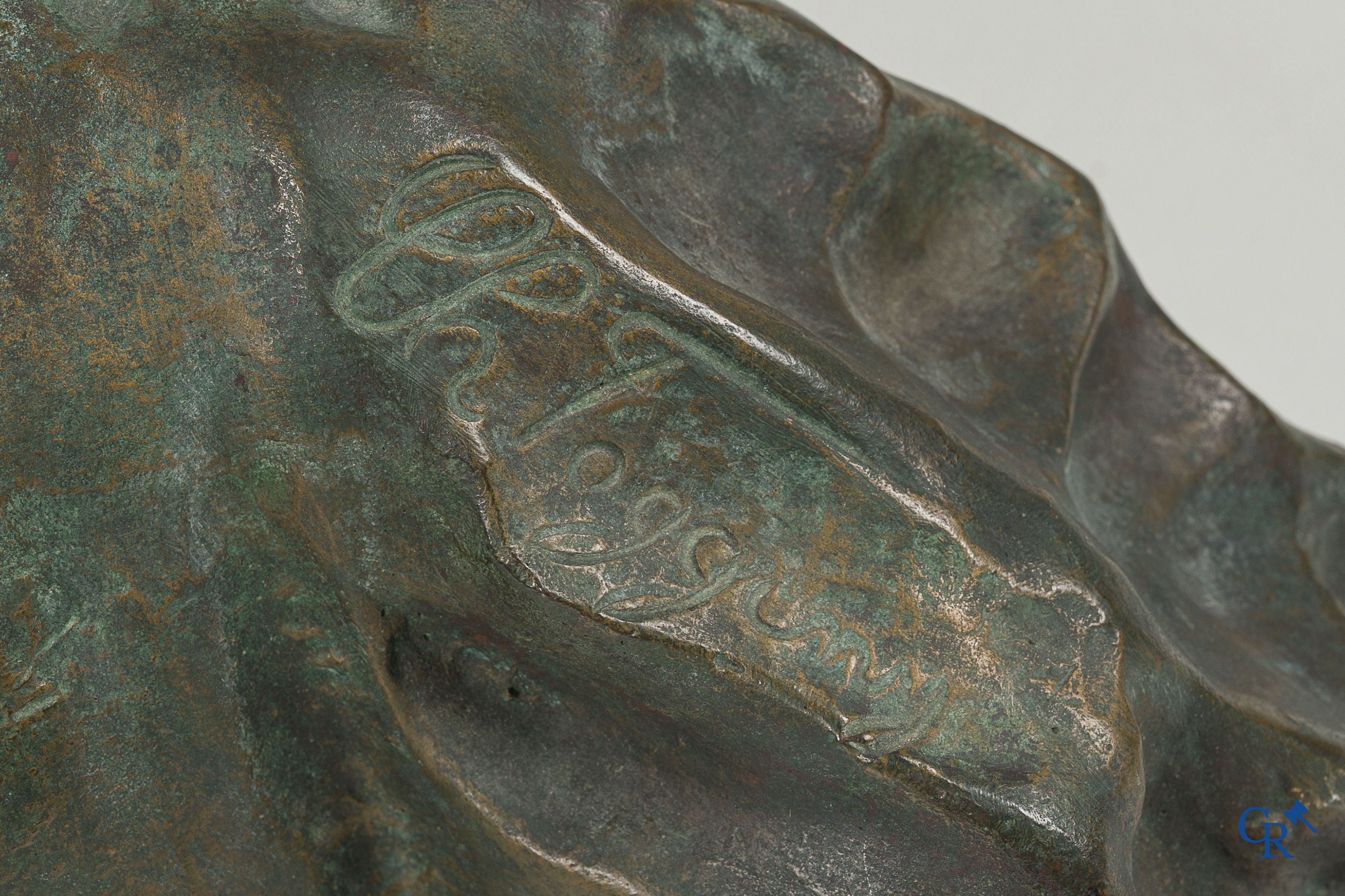 Art Nouveau. Bust of a young lady in Carrara marble and brown-green patinated bronze. Signed, circa 1900.