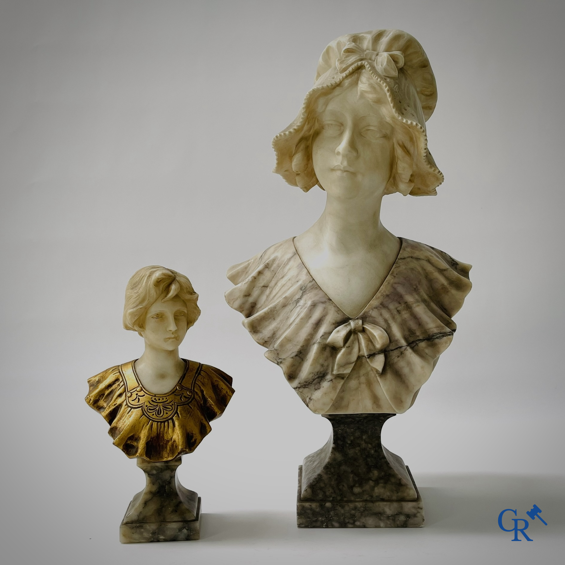 G. Van Vaerenbergh. A large bust in marble signed Van Vaerenbergh and a bust in marble and bronze. Around 1920.