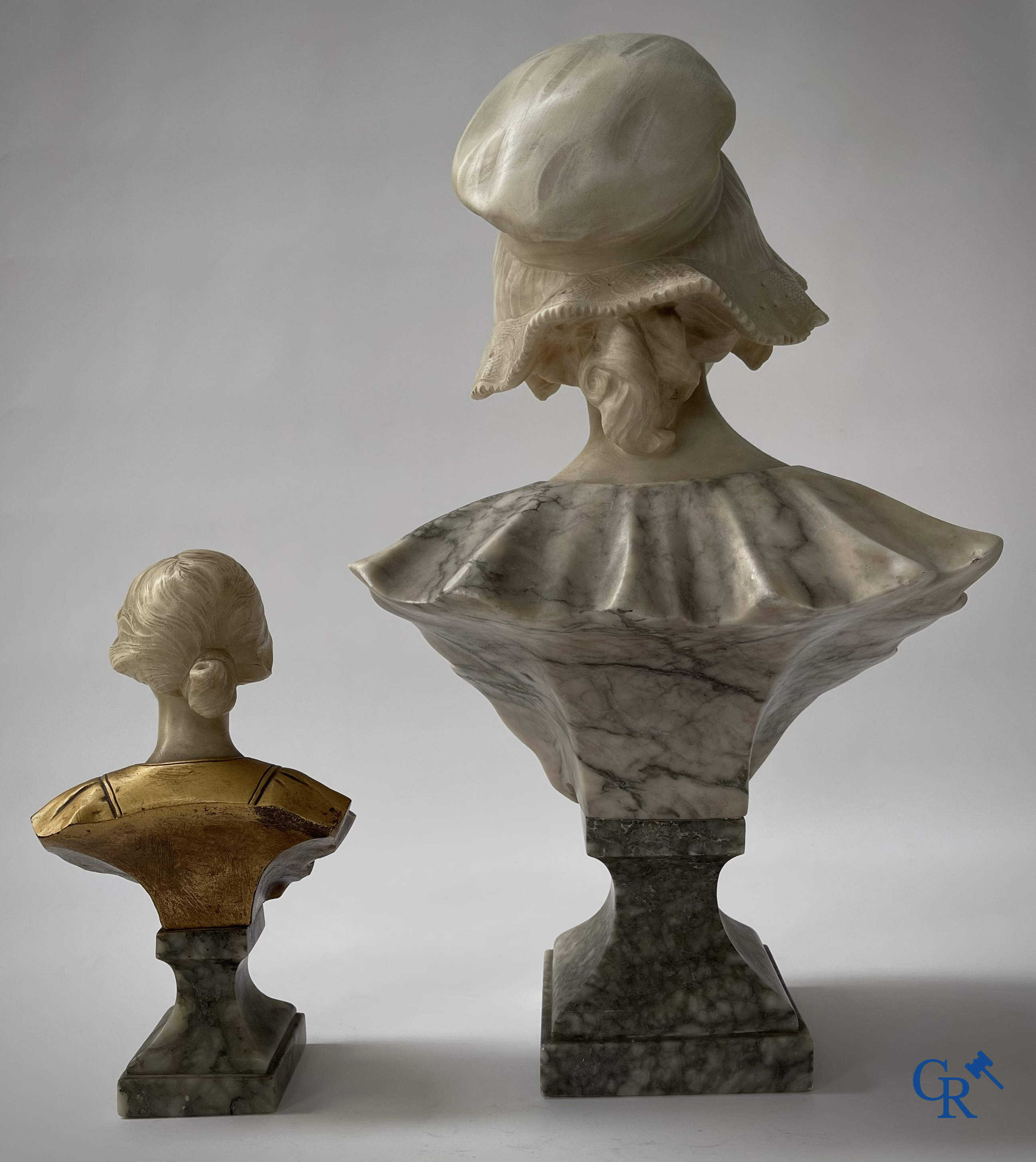 G. Van Vaerenbergh. A large bust in marble signed Van Vaerenbergh and a bust in marble and bronze. Around 1920.