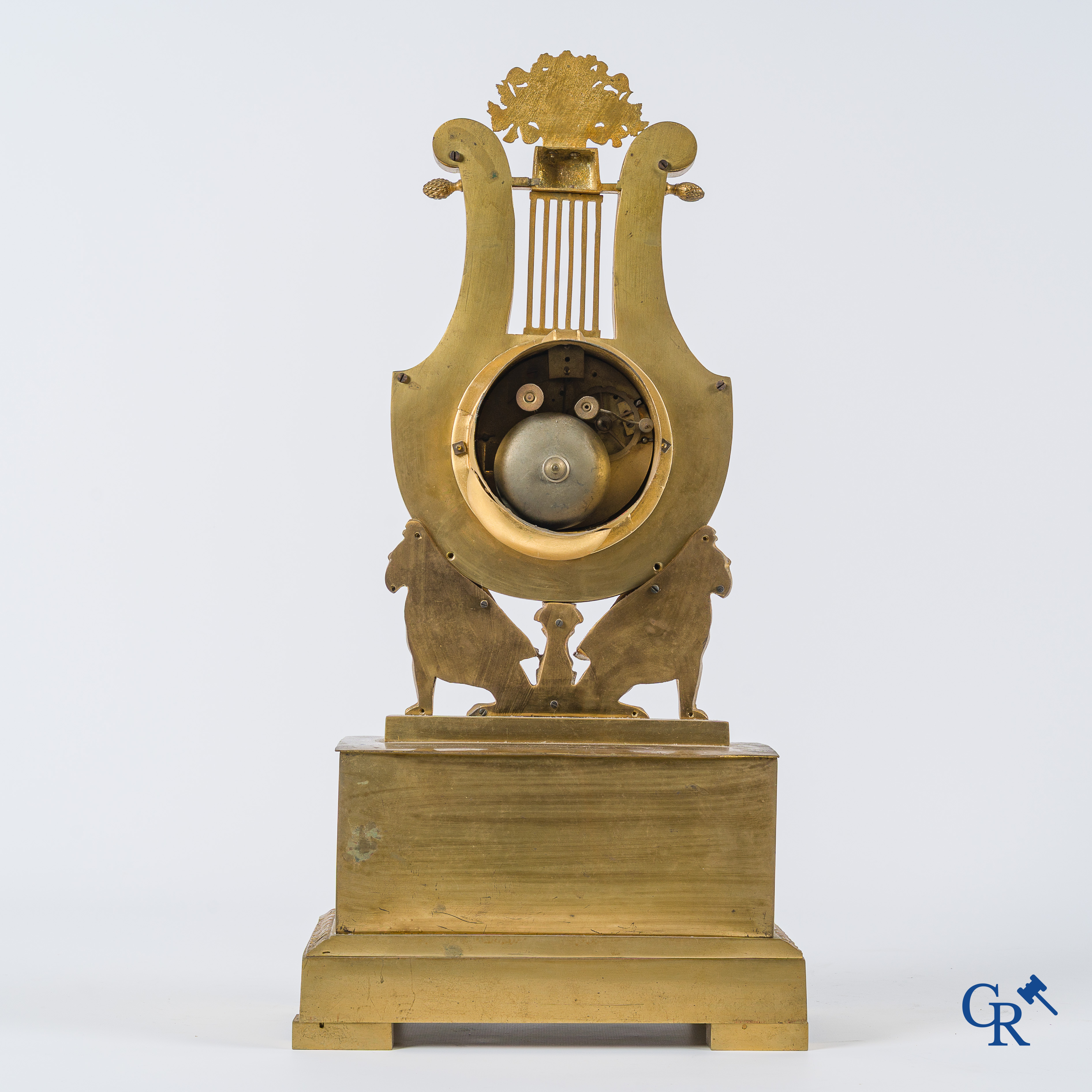 Charles X period. Beautiful pendulum in gilded bronze, a lyre held up by griffins. France, circa 1825.