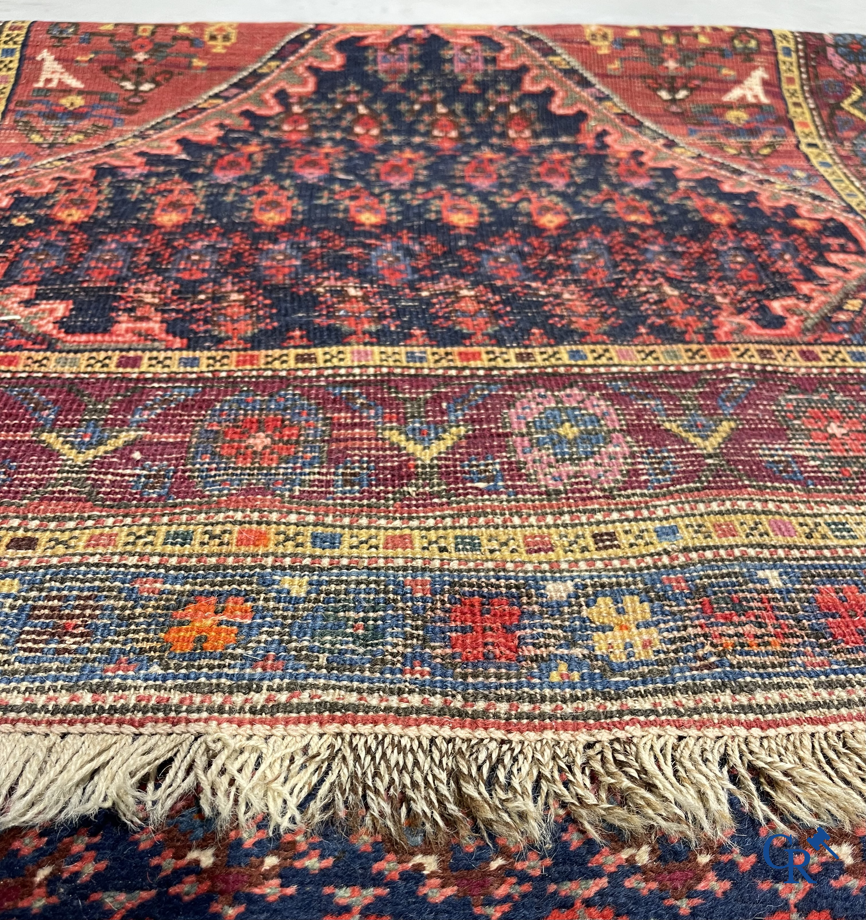 Oriental carpets. A large hand-knotted antique runner with geometric motifs. 19th century.
