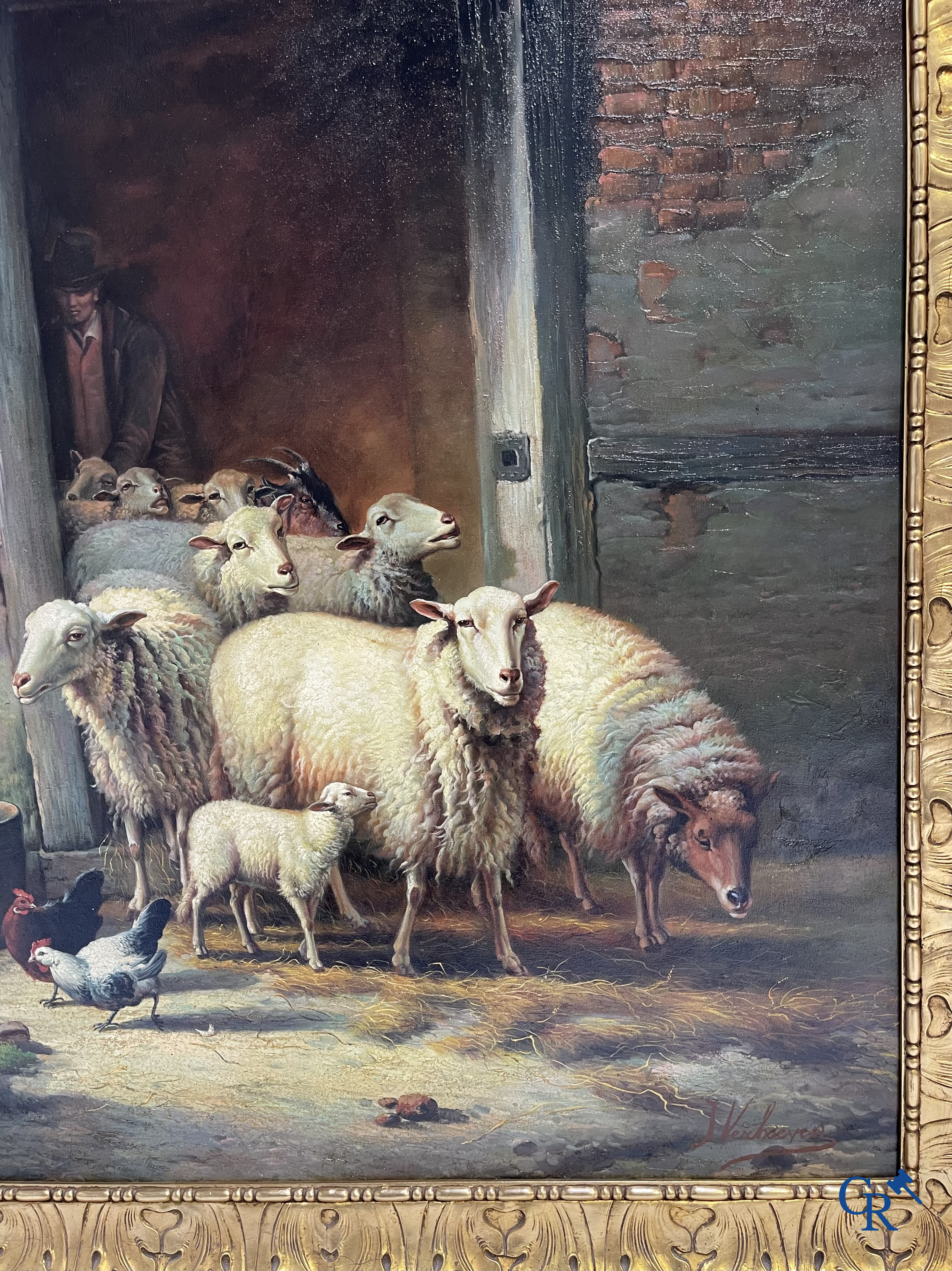 J. Verhoeven. Groot schilderij in vergulde houten lijst. Schapen bij de stal. Olie op doek. Rechtsonder gesigneerd.