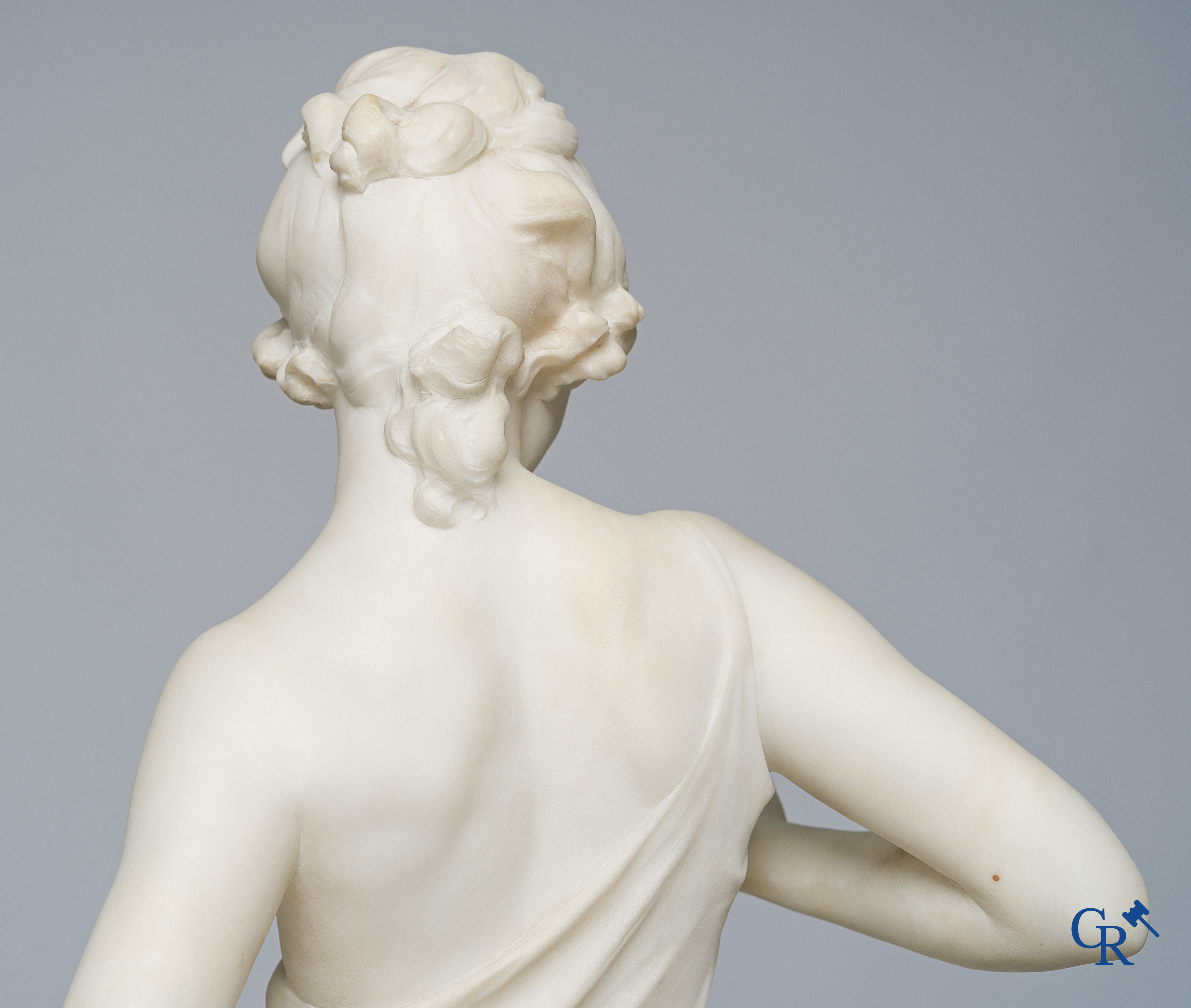 Cipriani. Romantic representation in sculpted marble. Young lady with cupid. LXVI style pedestal. Circa 1900.