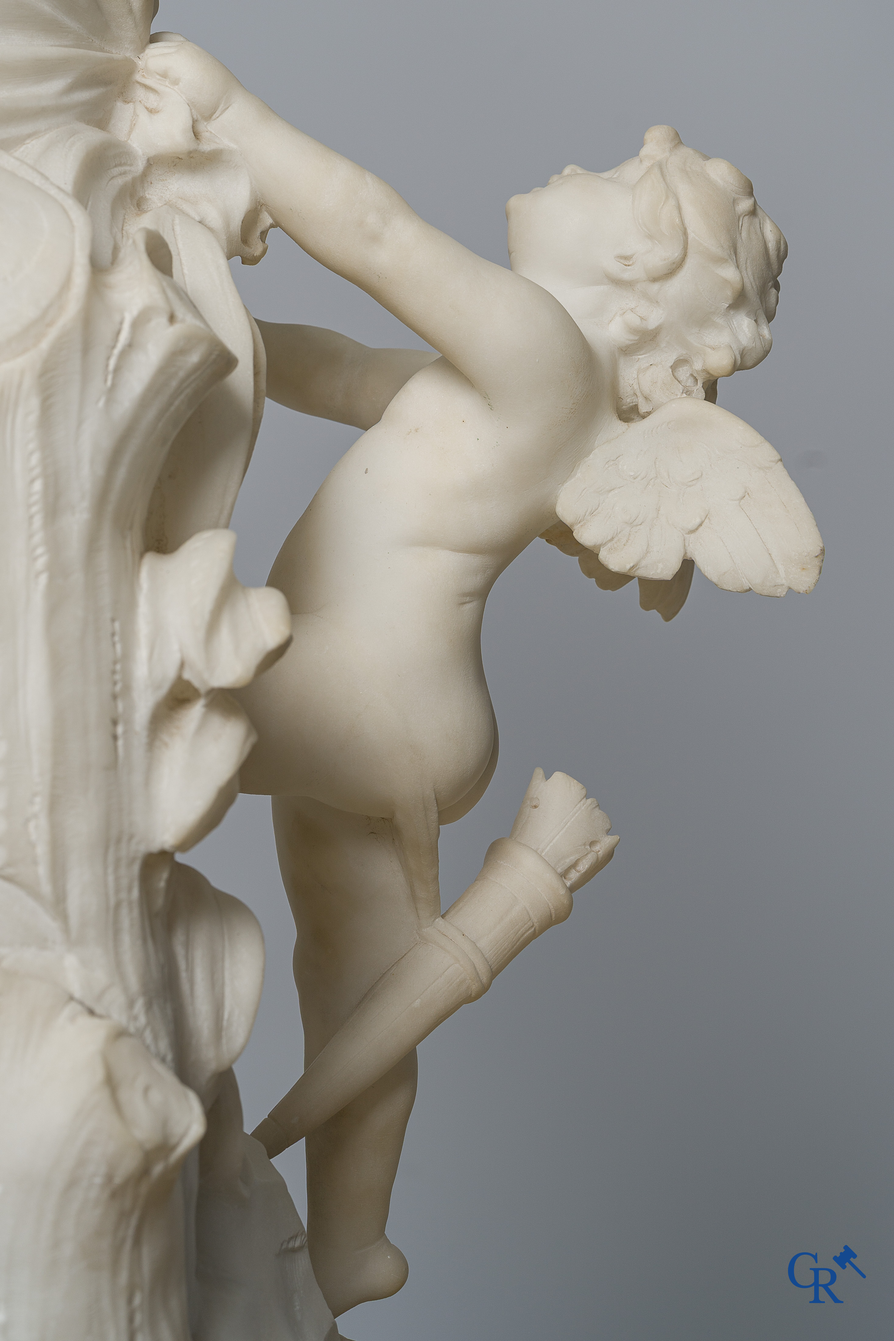 Cipriani. Romantic representation in sculpted marble. Young lady with cupid. LXVI style pedestal. Circa 1900.