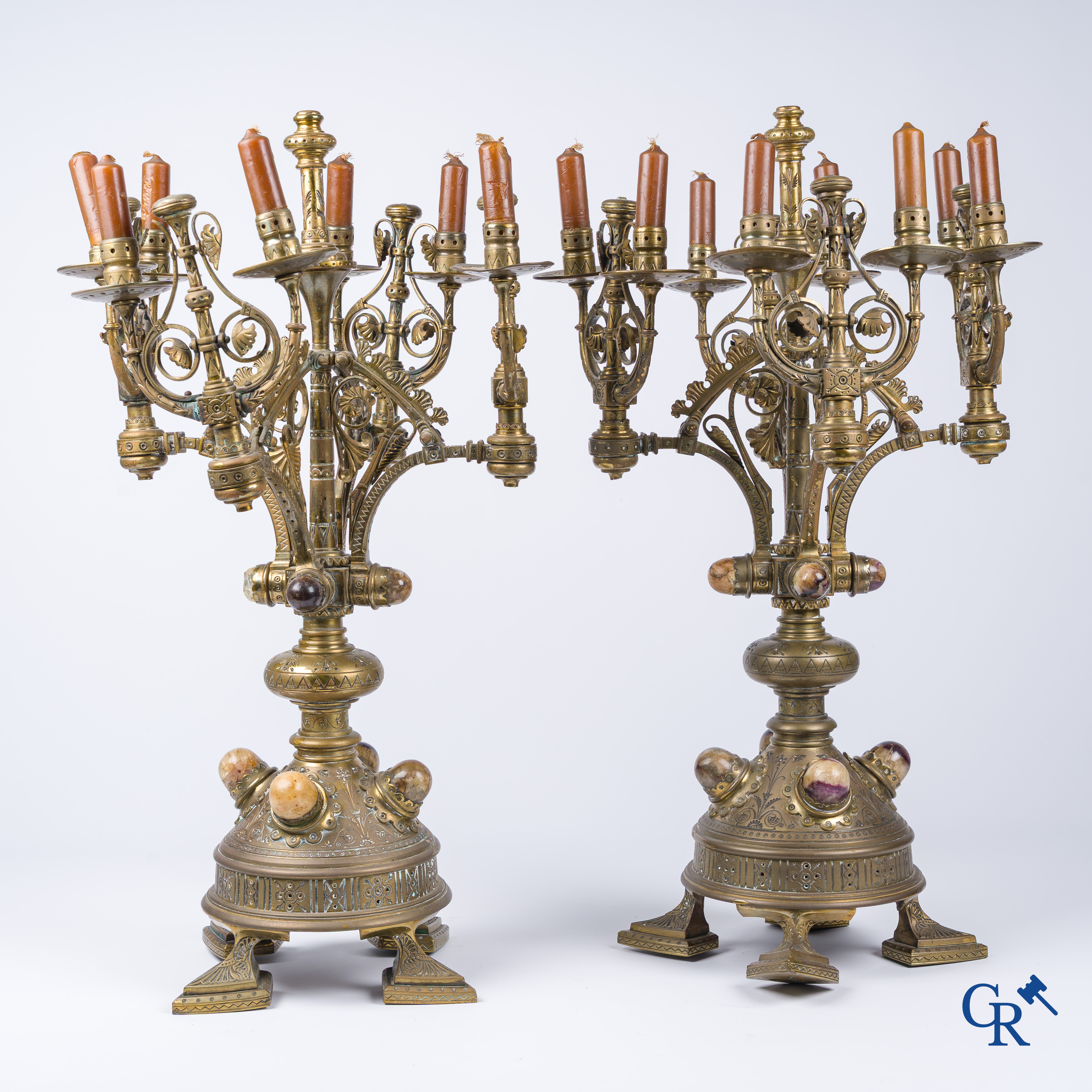 A pair of important bronze candlesticks decorated with various types of rock including amethyst. 19th century.