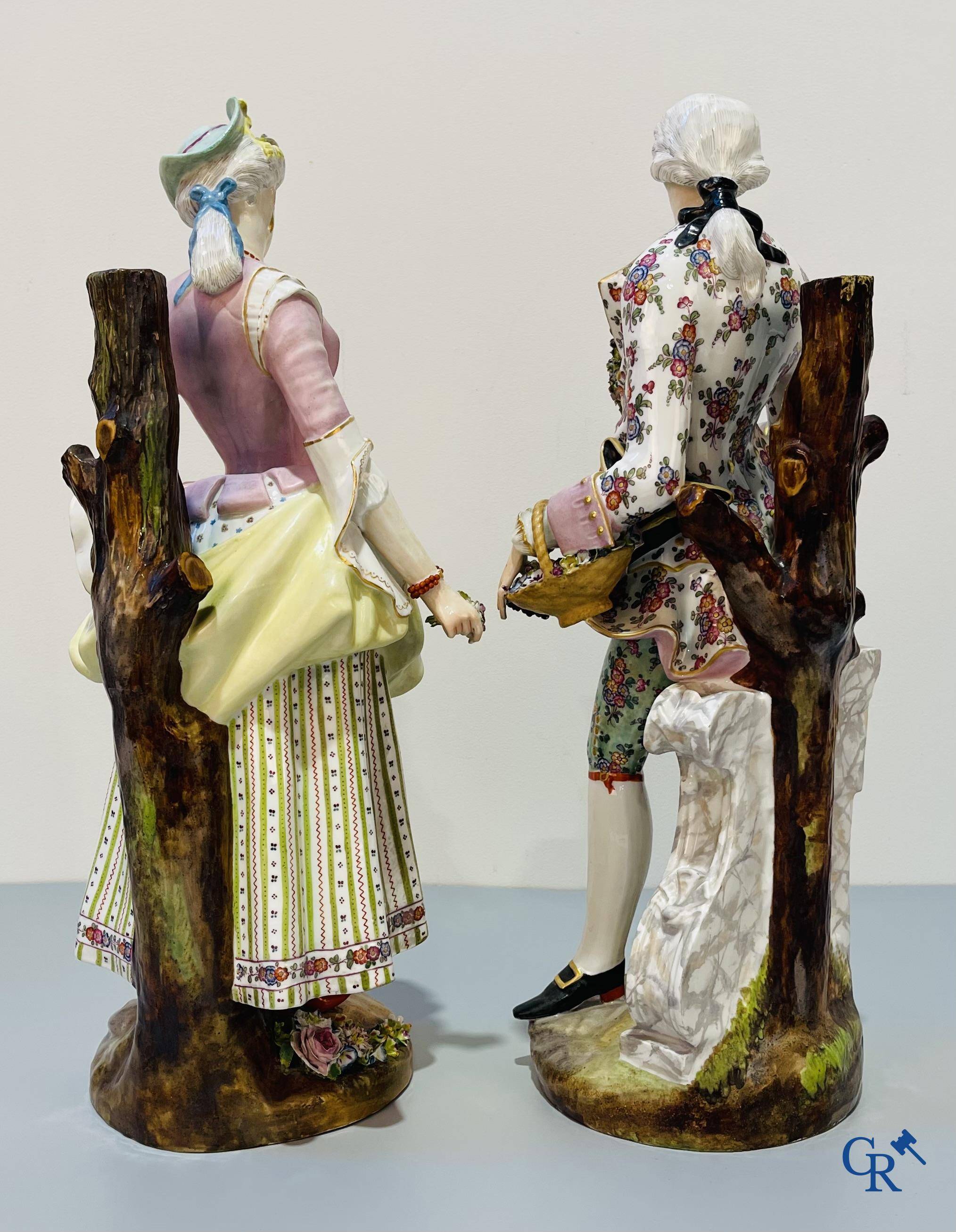 European porcelain, Meissen, a couple in finely polychromed German porcelain. Marked with the swords.