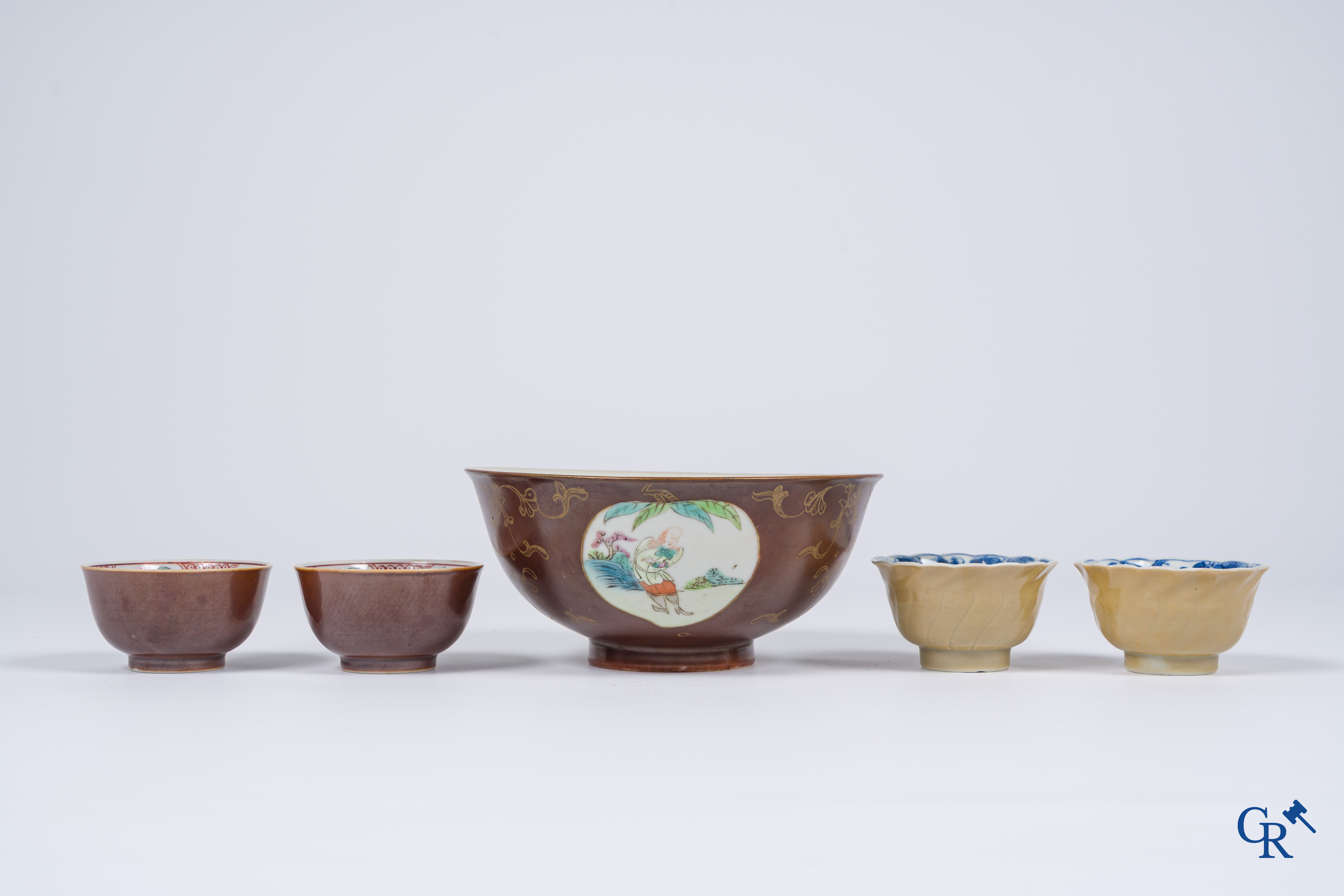 Asian Art, Chinese porcelain. A large Chinese "café au lait" bowl and saucer. 4 cups with saucers attached.