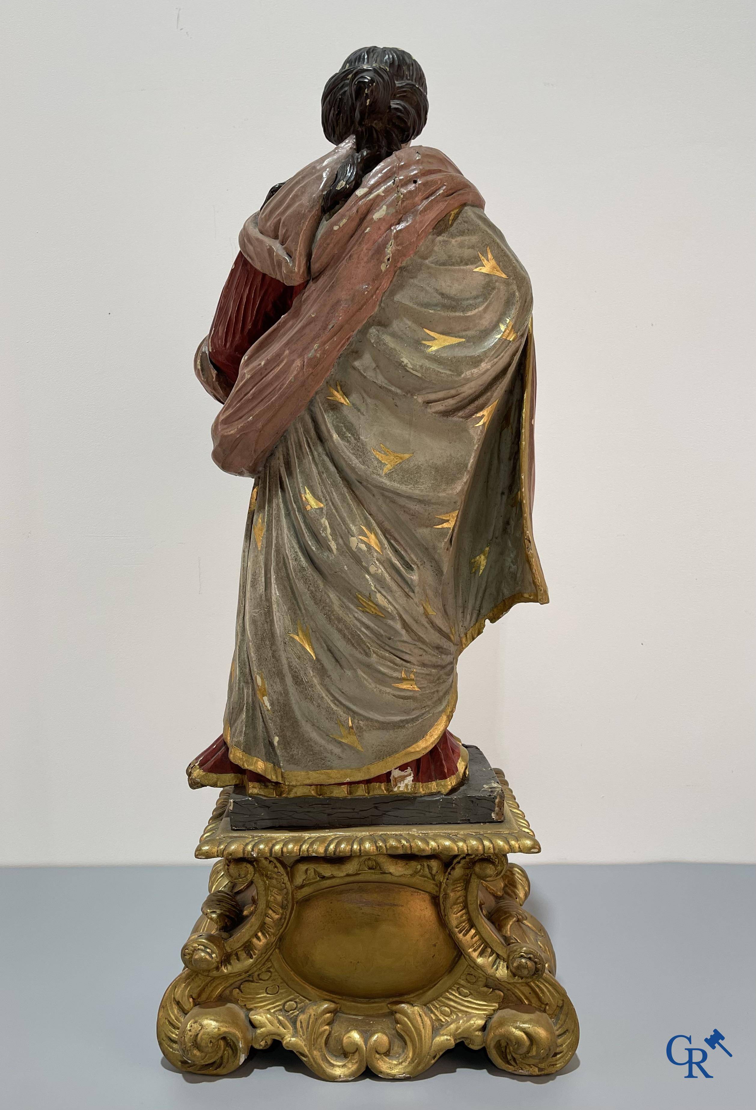 Religious objects, a finely carved and polychrome wooden statue of Saint Catherine in Baroque style. 18th century.