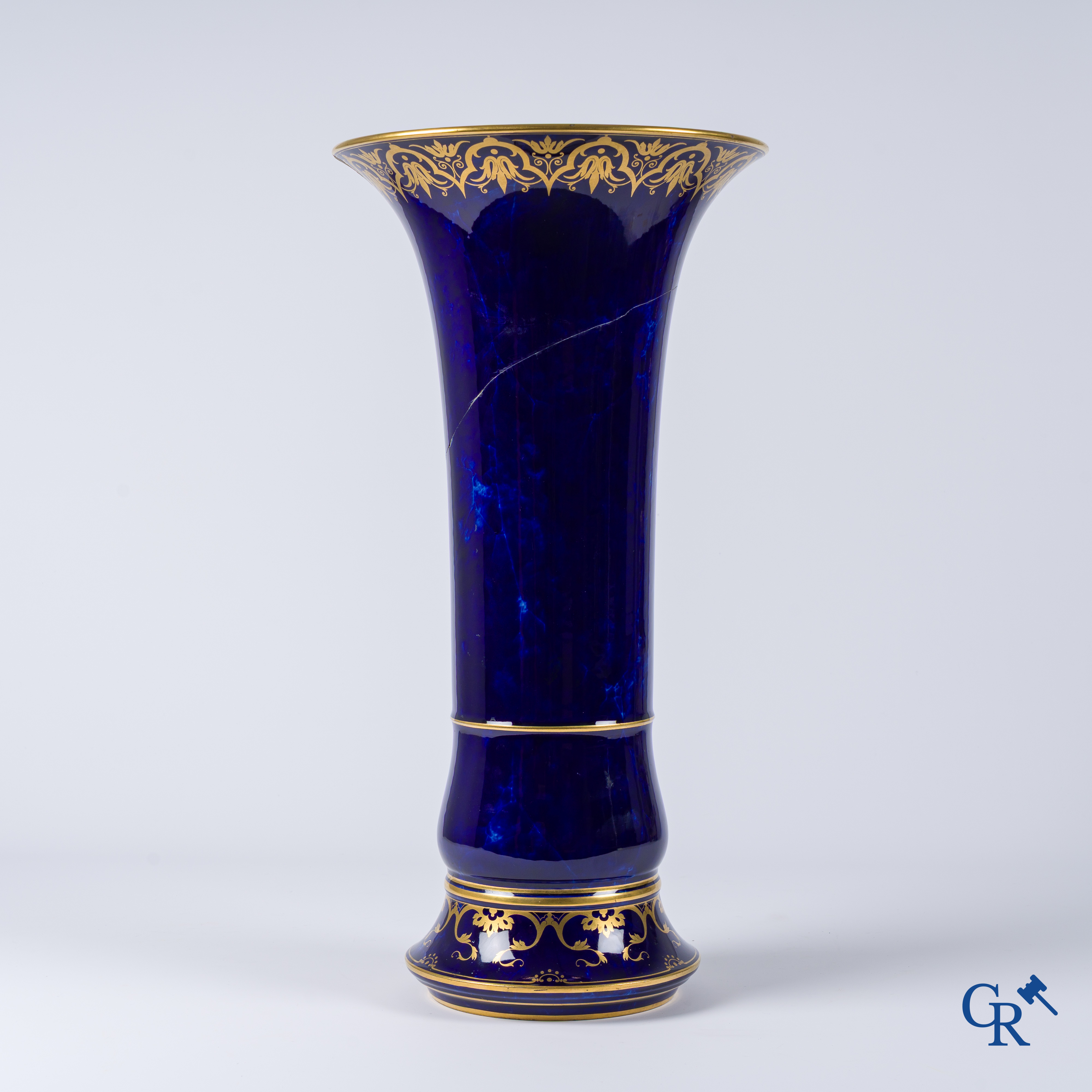 Manufacture Nationale de Sèvres. important vase with a gilded decor on a blue background colour.