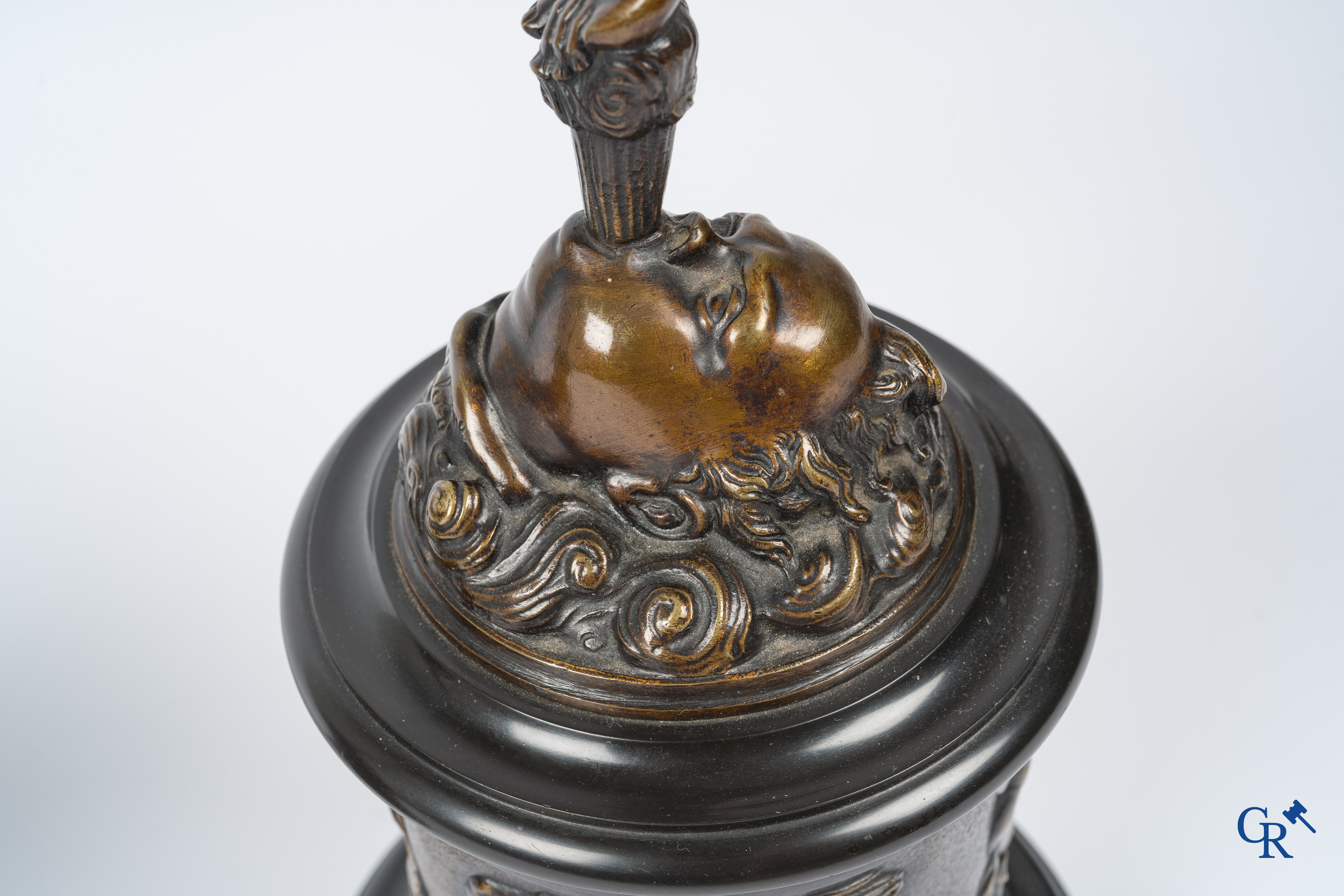 A pair of imposing bronze statues in the antique style after a model by Jean De Bologne.