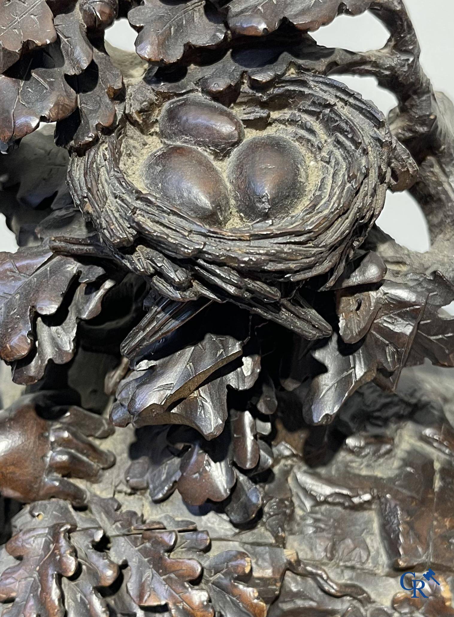 A finely carved walnut clock in so-called "black forest" carving. French work circa 1860-1880.