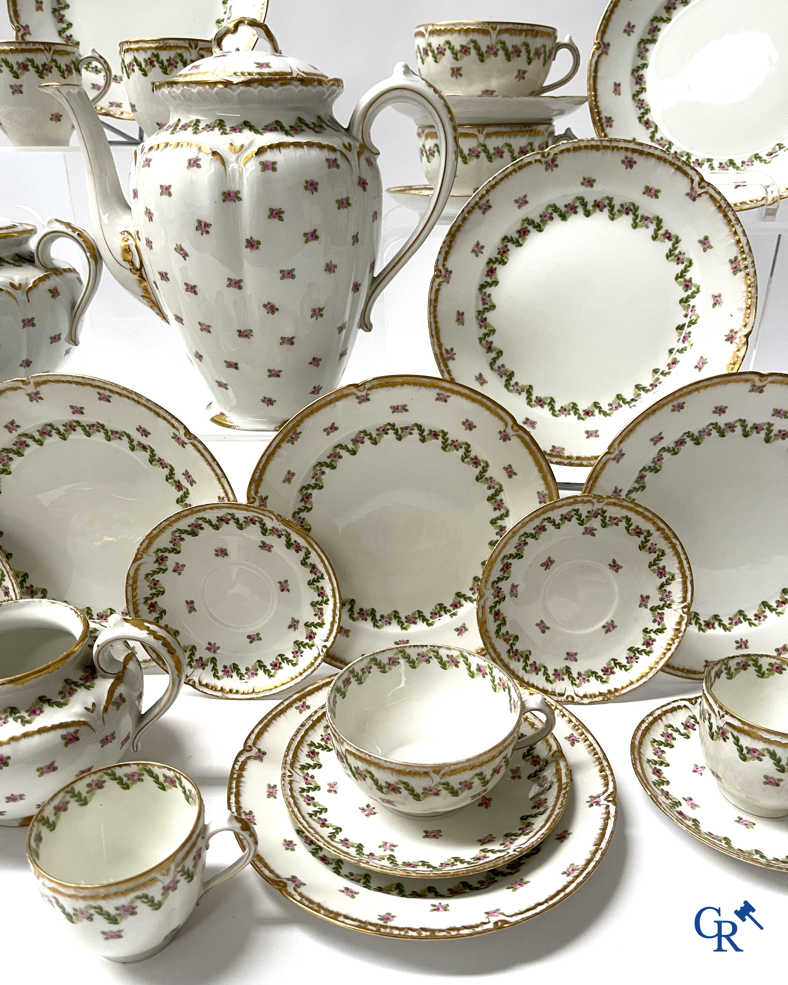 A coffee and tea set with 12 dessert plates in gilded and polychrome decorated French porcelain. Around 1900.