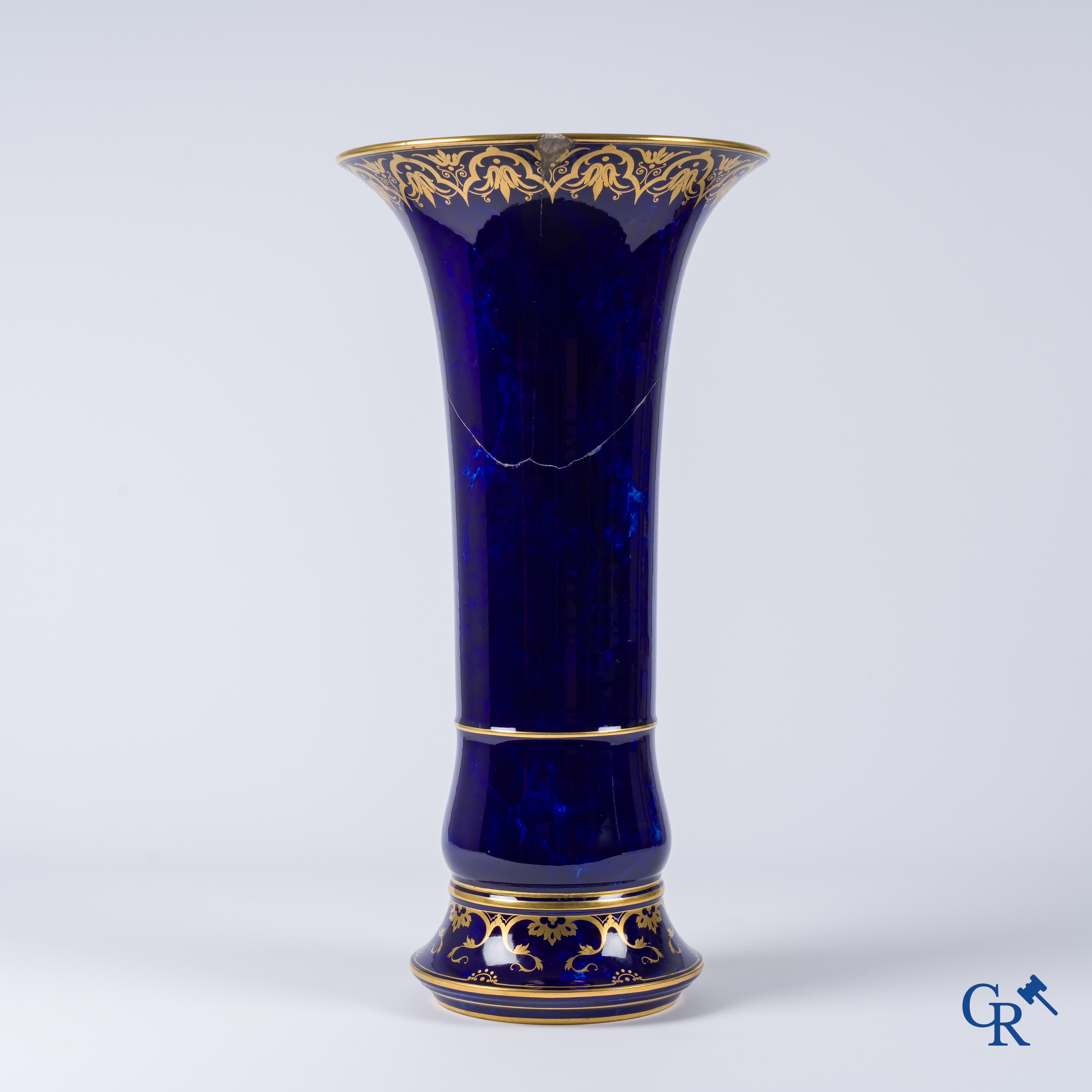 Manufacture Nationale de Sèvres. important vase with a gilded decor on a blue background colour.