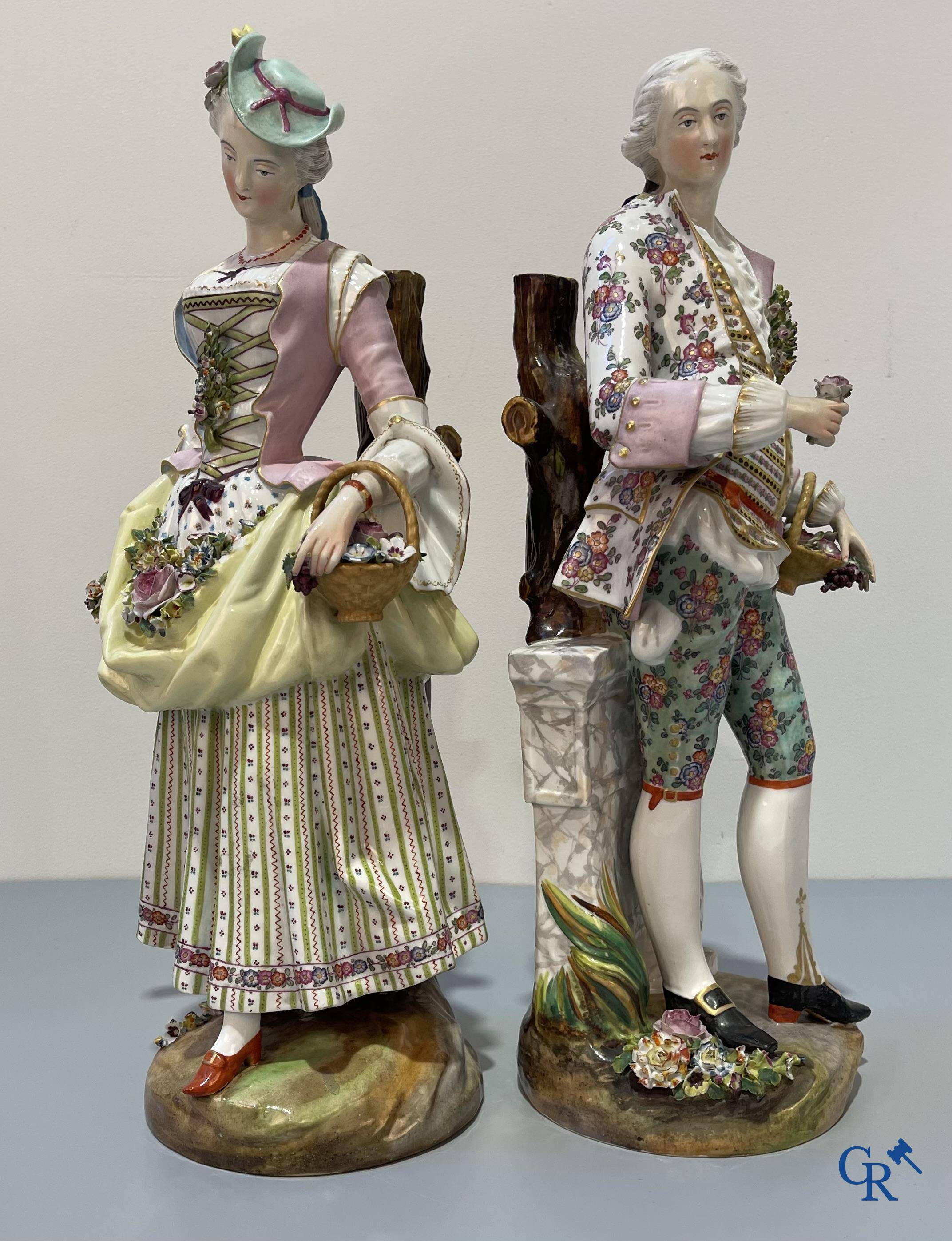 European porcelain, Meissen, a couple in finely polychromed German porcelain. Marked with the swords.