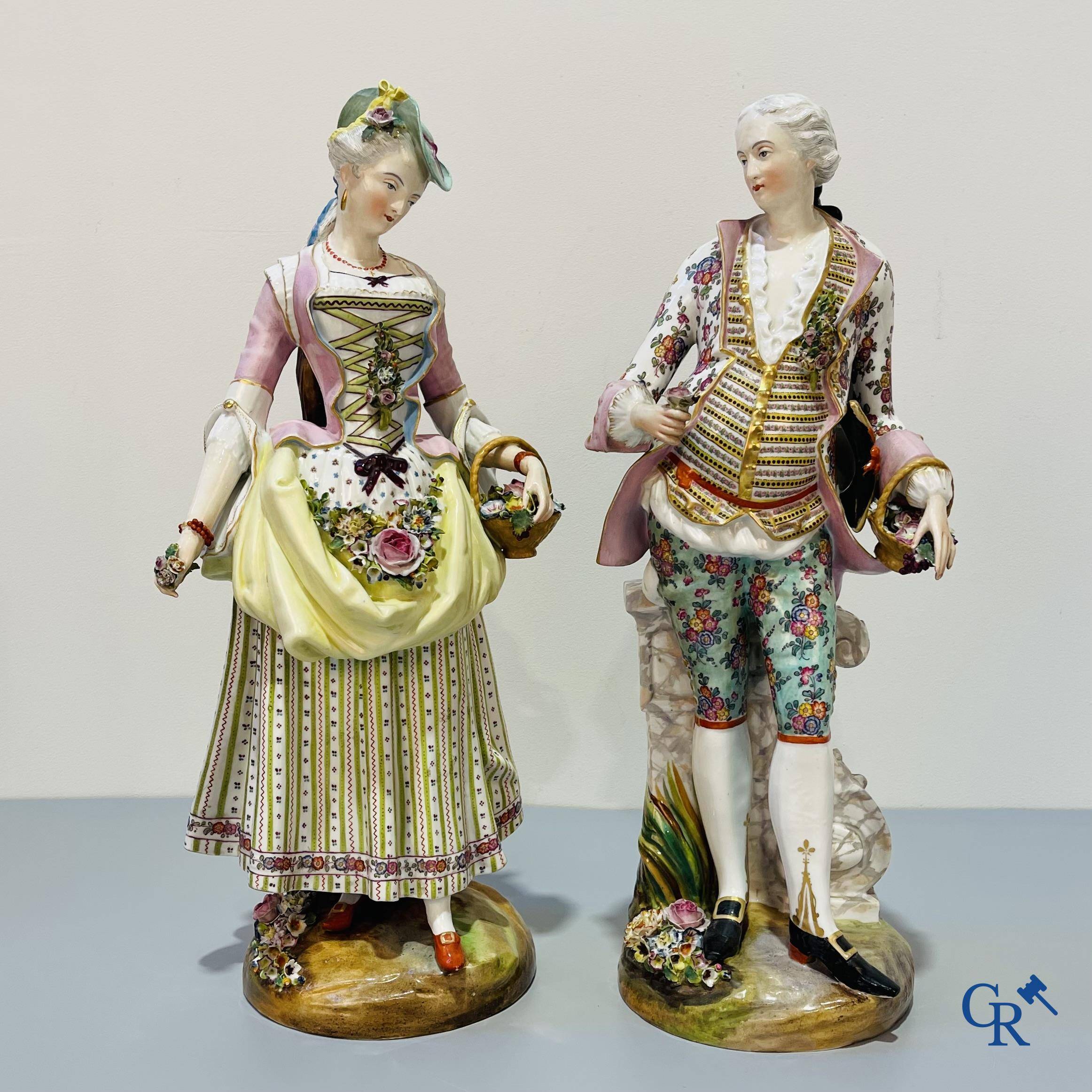 European porcelain, Meissen, a couple in finely polychromed German porcelain. Marked with the swords.