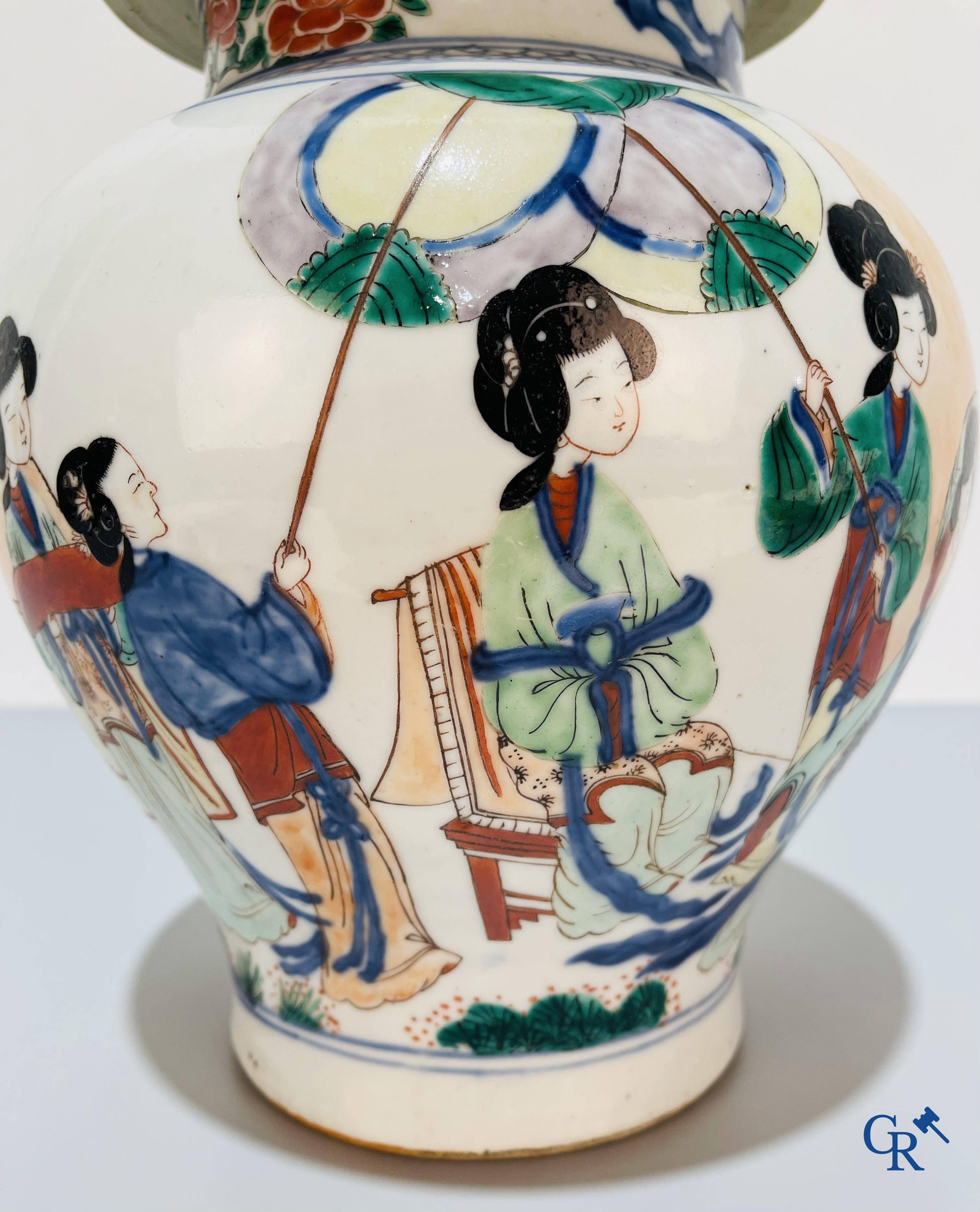 Asian Art, Chinese porcelain, a Chinese Wucai lidded vase with characters.