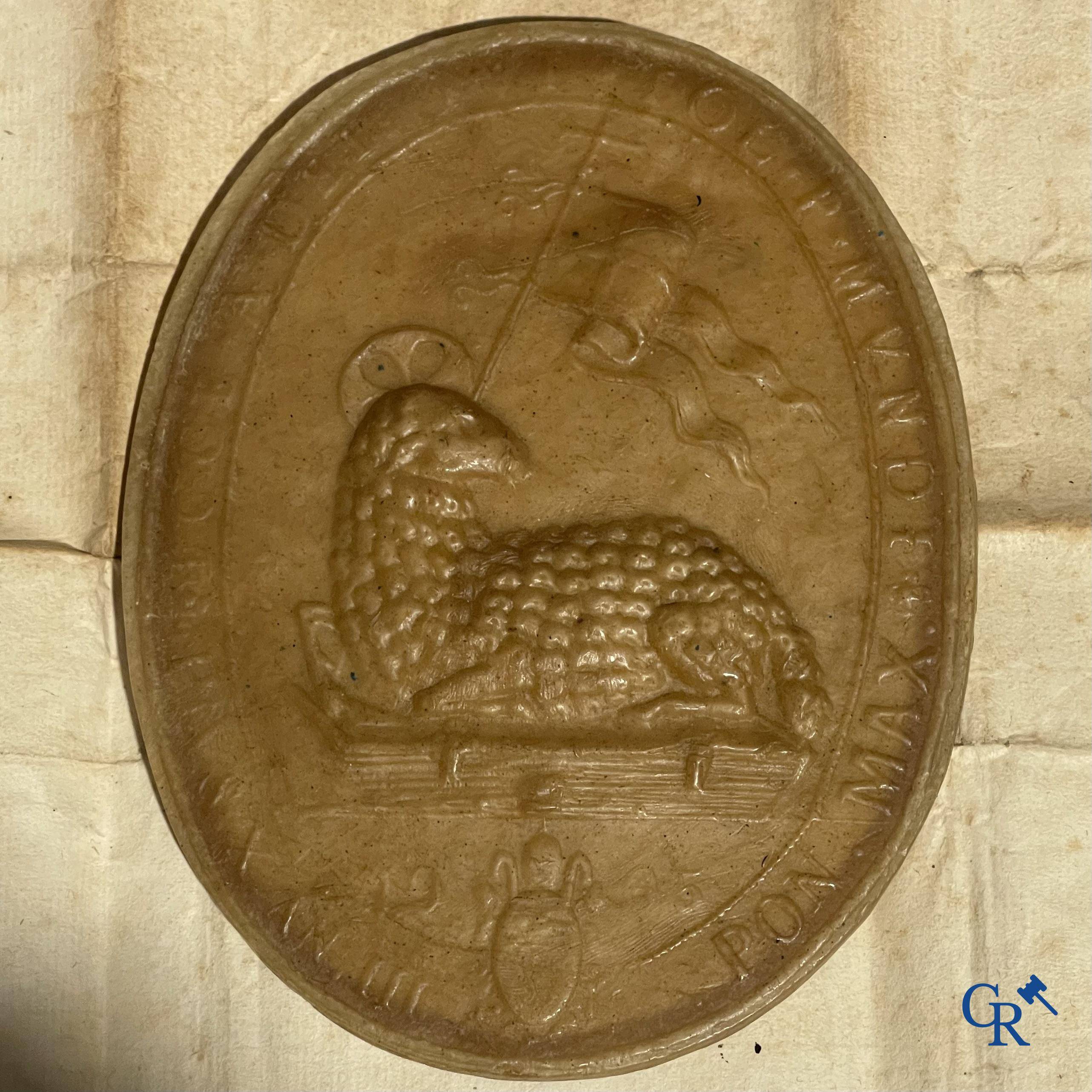 Religious objects, Agnus Dei in wax, blessed by Pope Pius X in 1905, with the image of Bernard of Clairvaux.