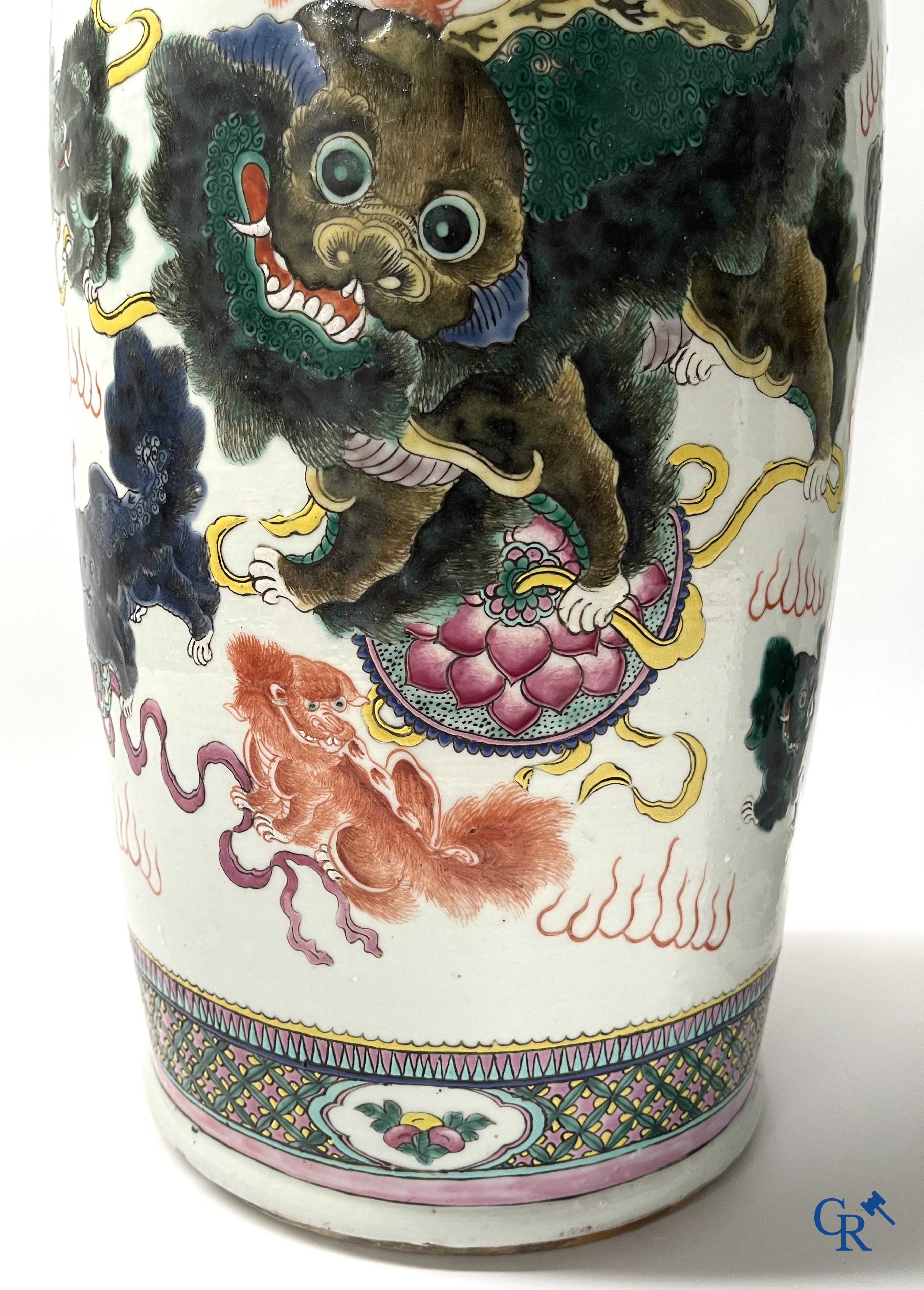 Asian Art, A pair of Chinese famille rose vases with peacocks and Fo dogs. 19th century.