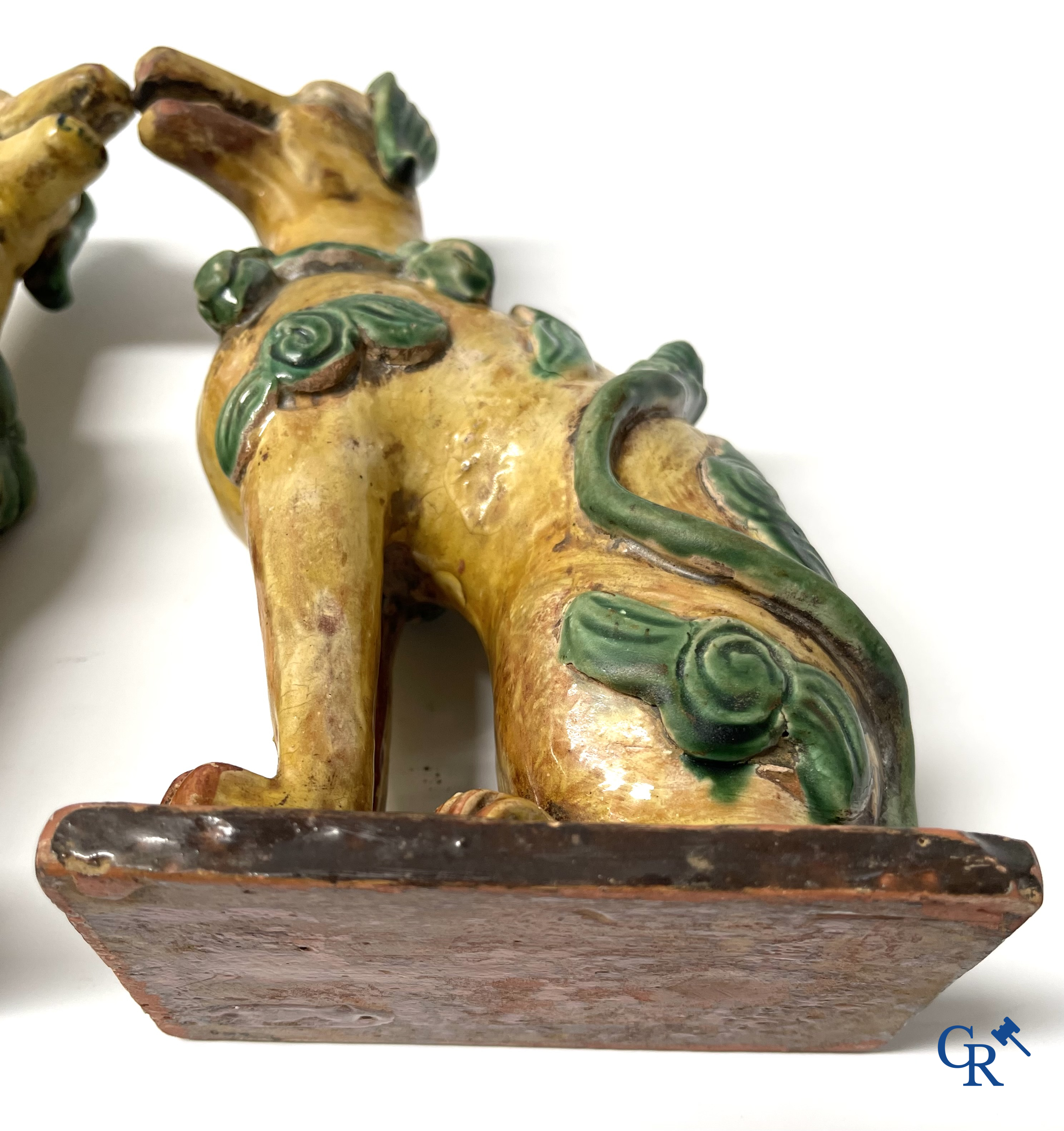 Asian Art, Chine. A pair of seated enamelled terra cotta dogs.