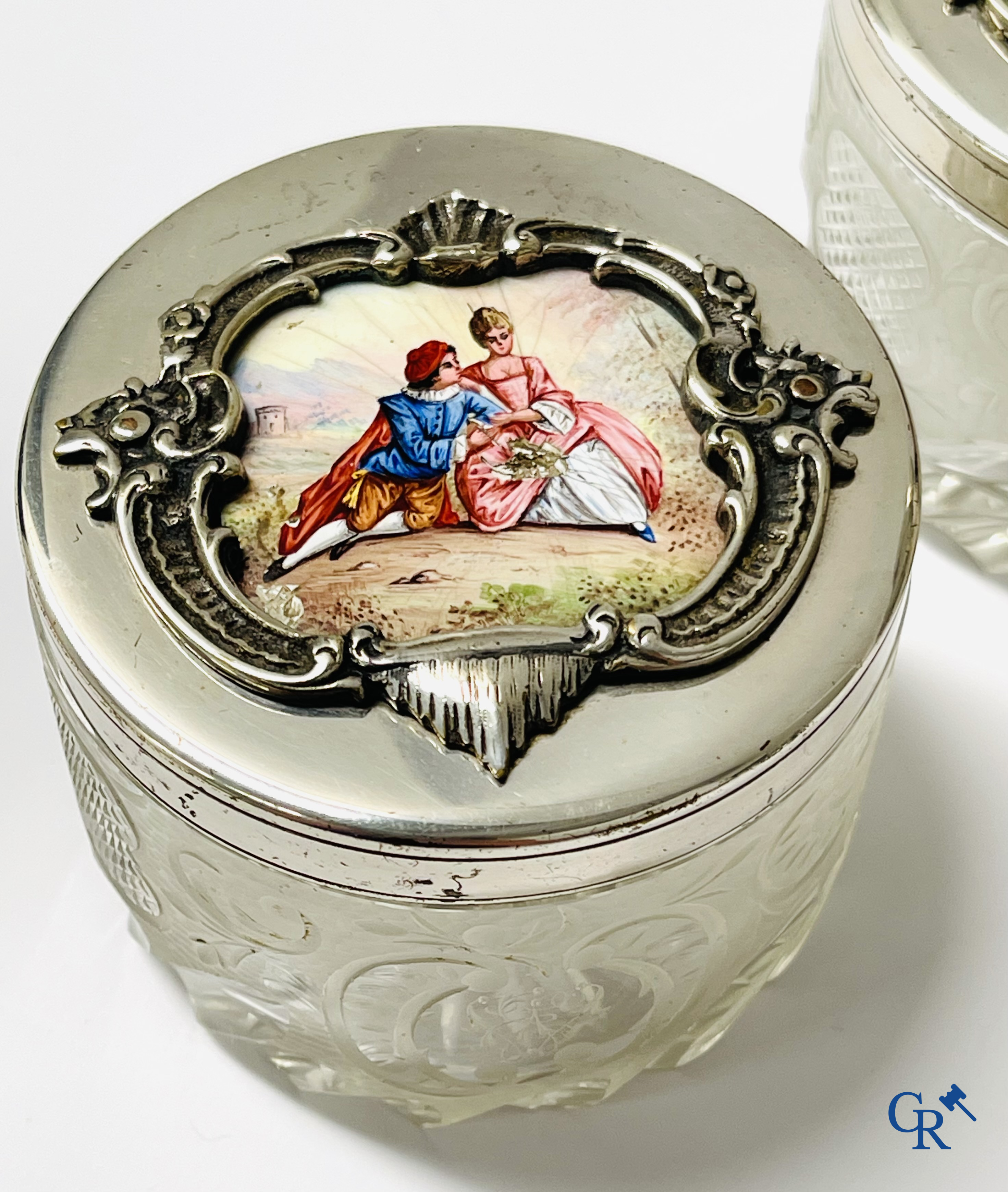 A seven-piece toilet set in silver-plated metal, finely cut crystal and enamelled plaques.