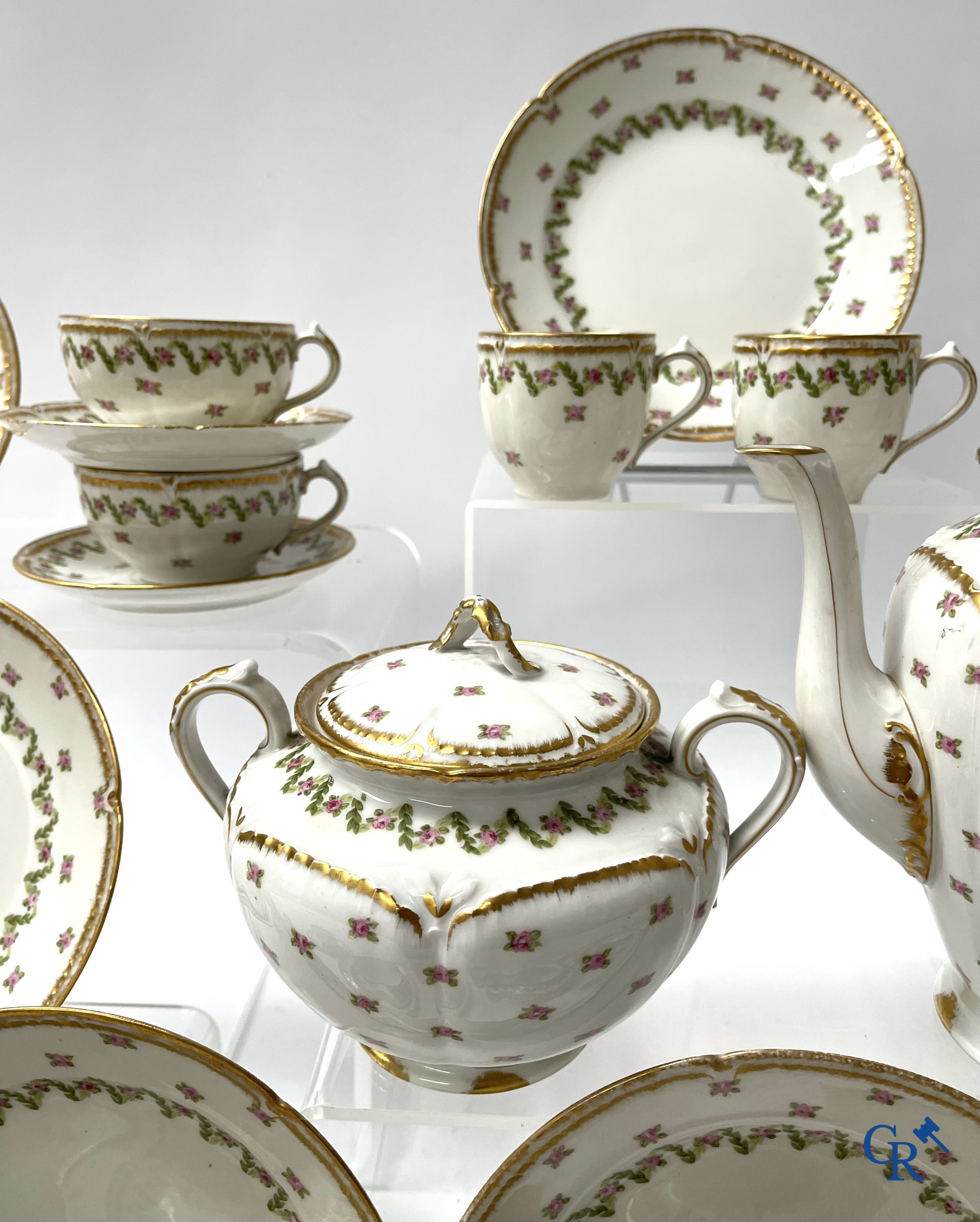 A coffee and tea set with 12 dessert plates in gilded and polychrome decorated French porcelain. Around 1900.