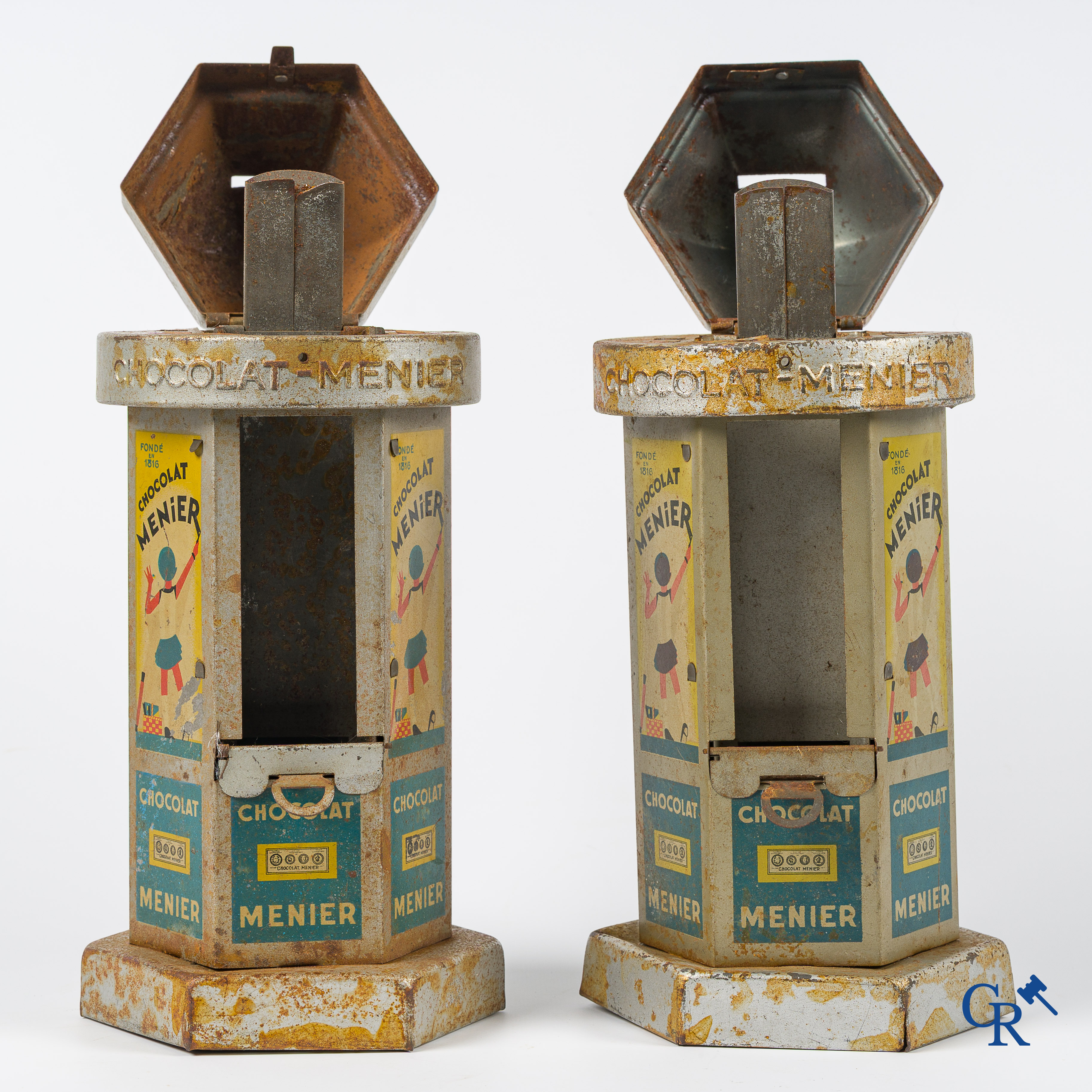 Chocolat Menier. 2 kiosk-shaped money boxes or vending machines for chocolate bars from Menier. 1930's -'40's.