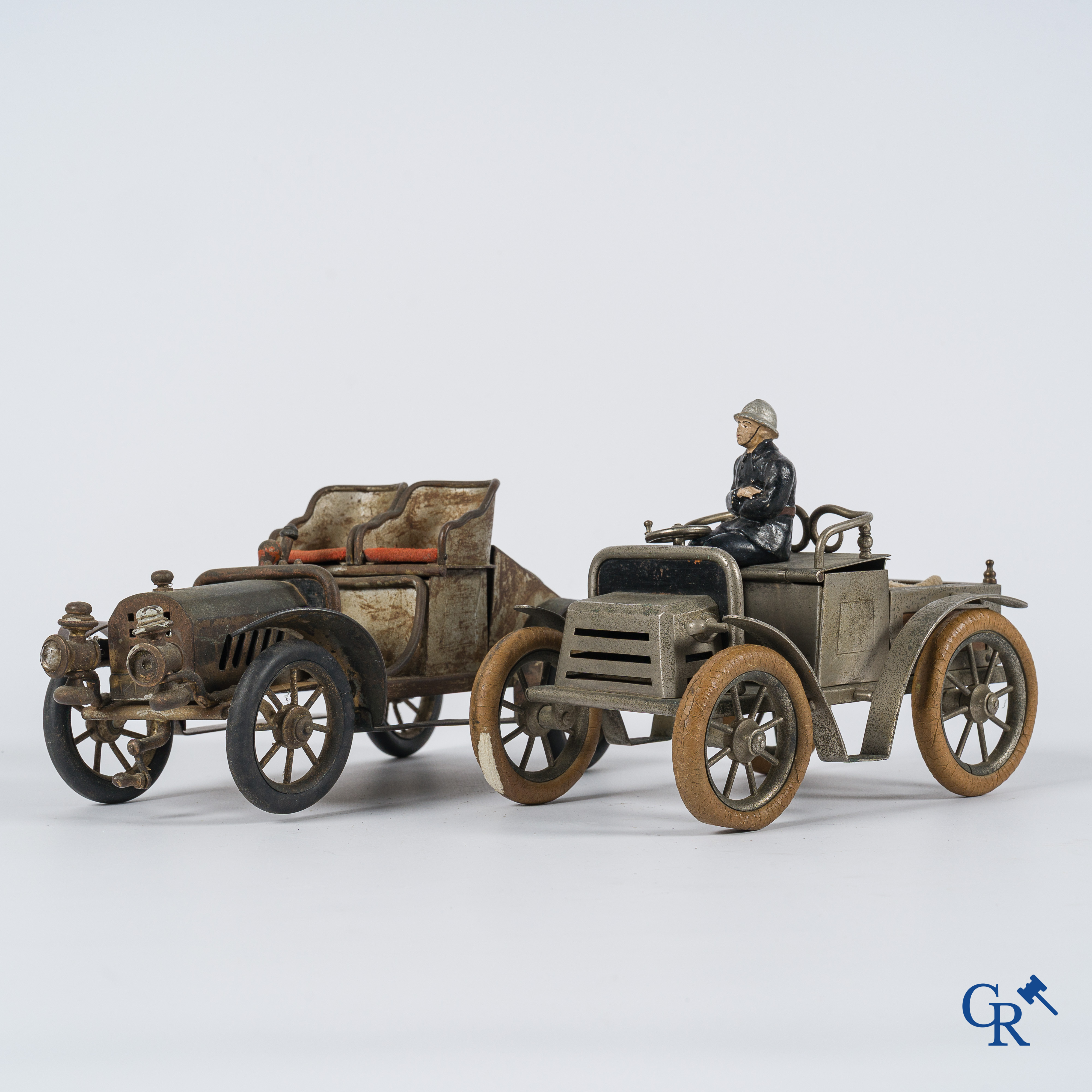 Chevob & Co. Desk set in the form of an open tourer with integrated clock and an early fire truck. Early 1900.