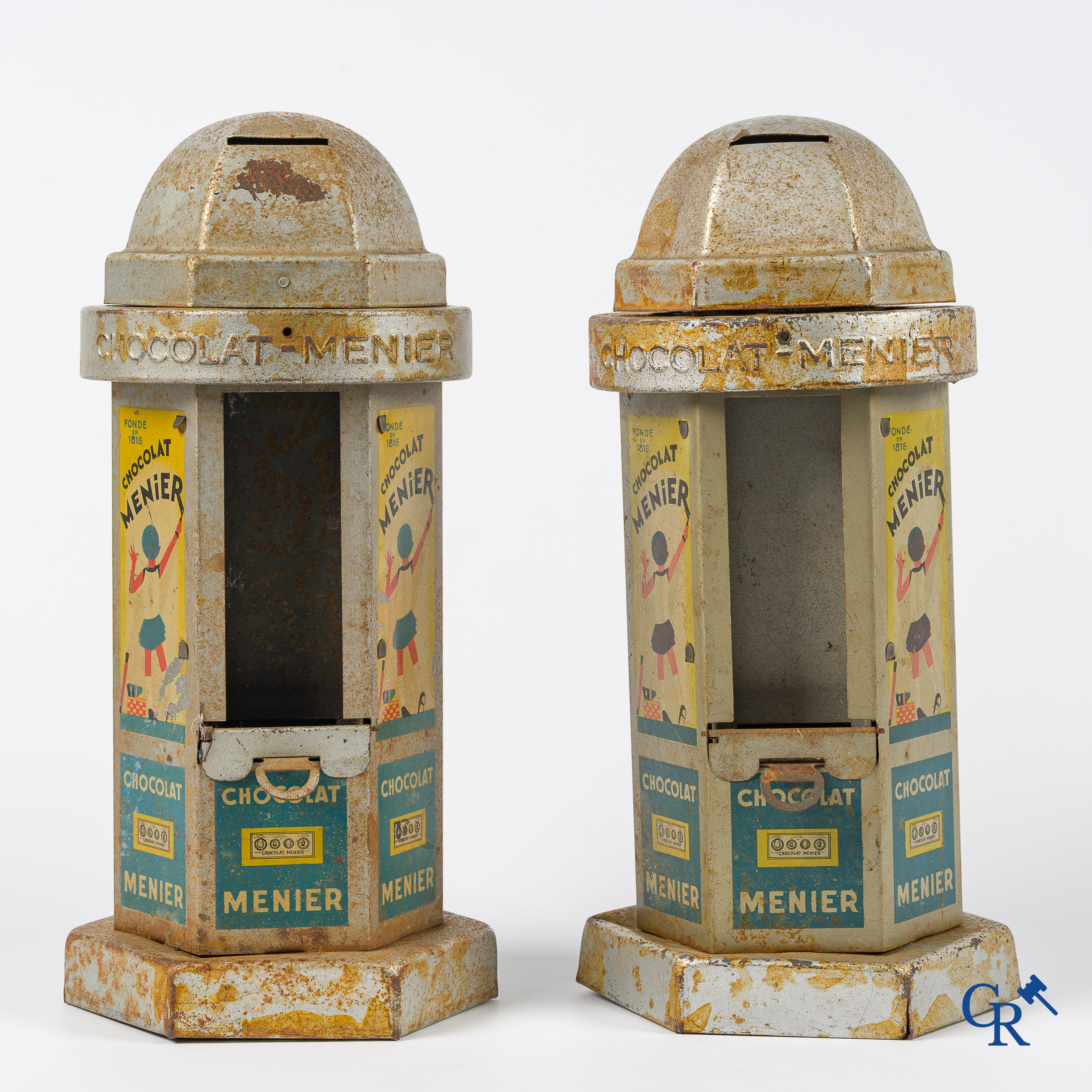 Chocolat Menier. 2 kiosk-shaped money boxes or vending machines for chocolate bars from Menier. 1930's -'40's.