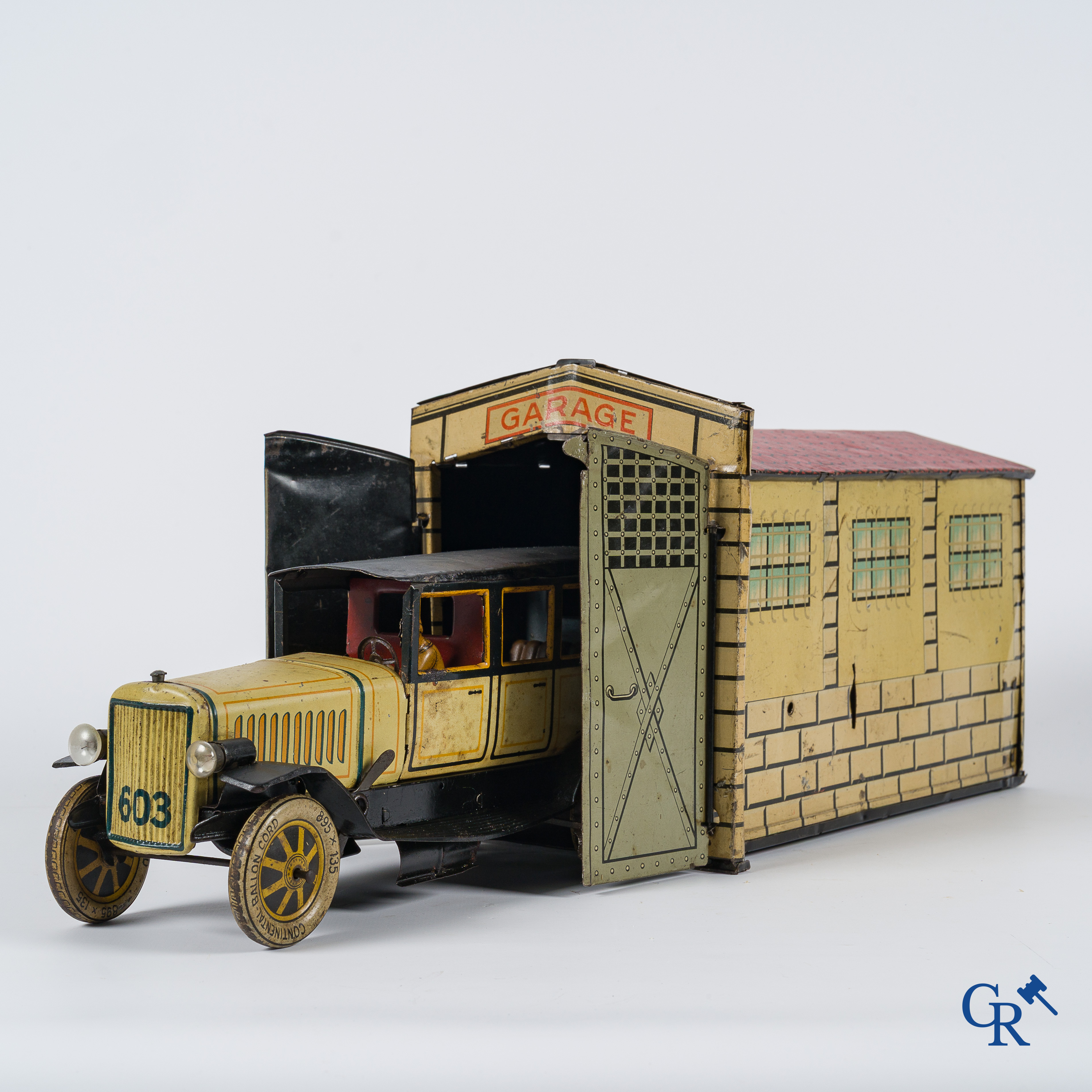 Old toys. Distler, Germany. Limousine with accompanying garage. Metal with winding mechanism. 1920's- 1930's.