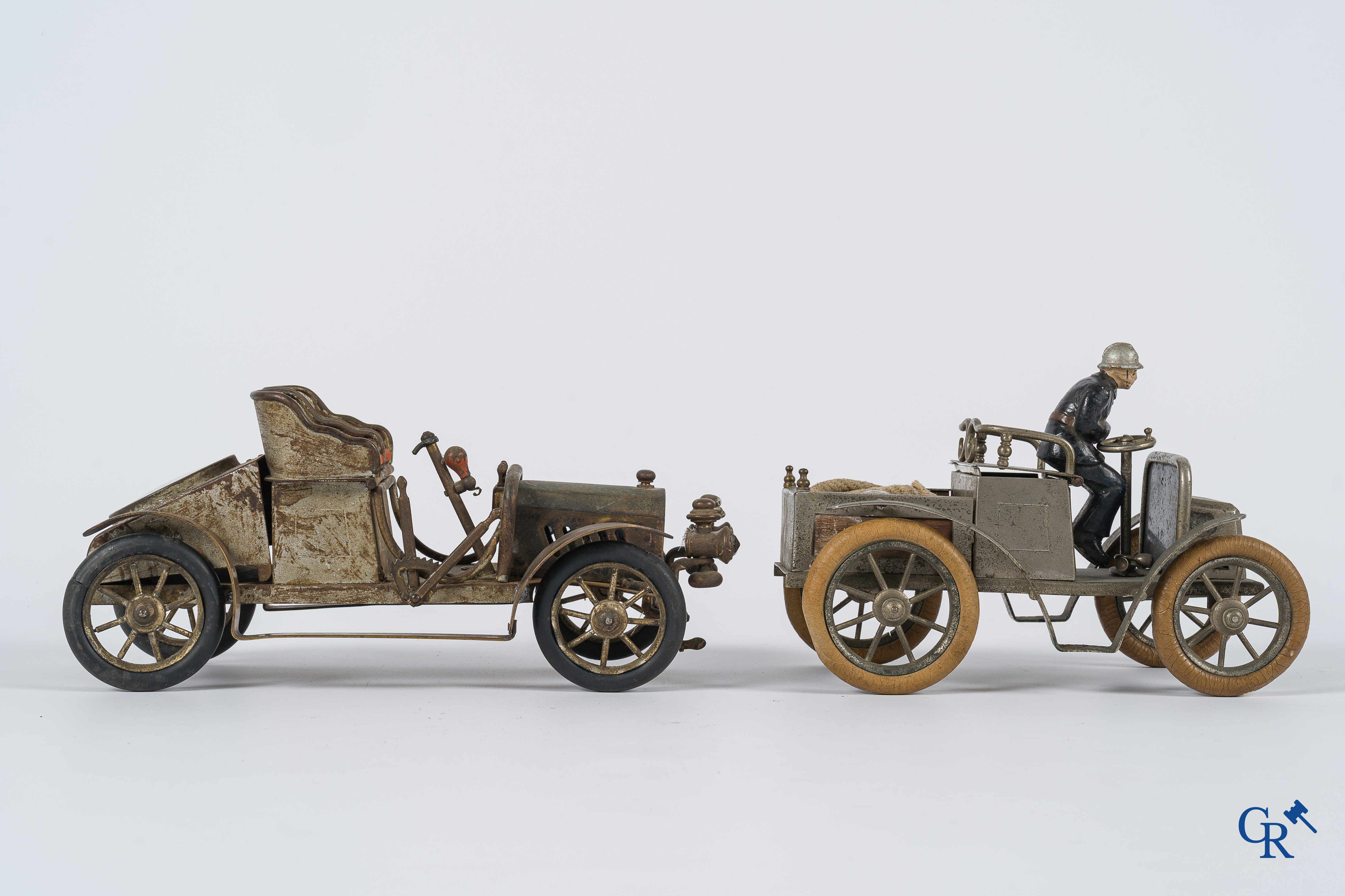 Chevob & Co. Desk set in the form of an open tourer with integrated clock and an early fire truck. Early 1900.