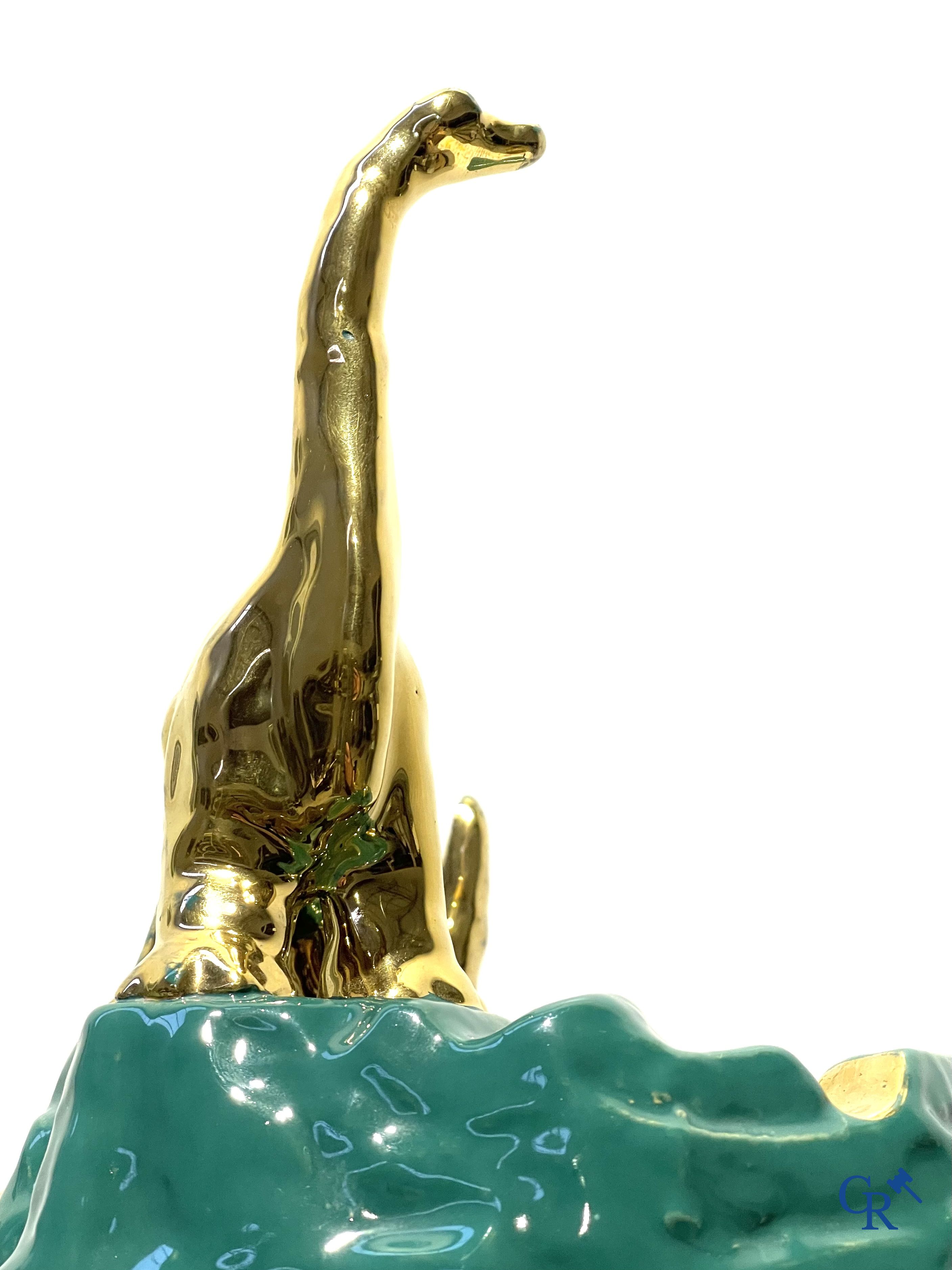 Sinclair. Publicity ashtray with a dinosaur in enamelled faience for the Sinclair Oil Corporation. 1950's.