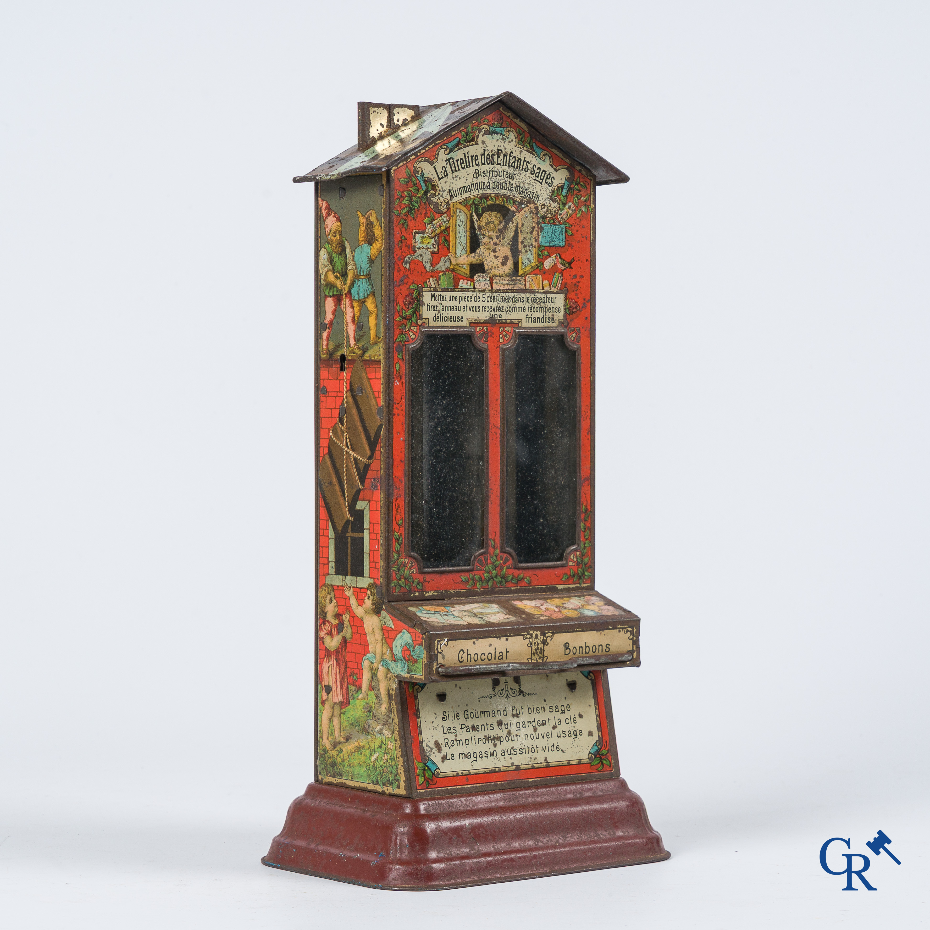 La tirelire des enfants sages. Money box and vending machine for chocolate and sweets. Painted tinplate. 1920's.