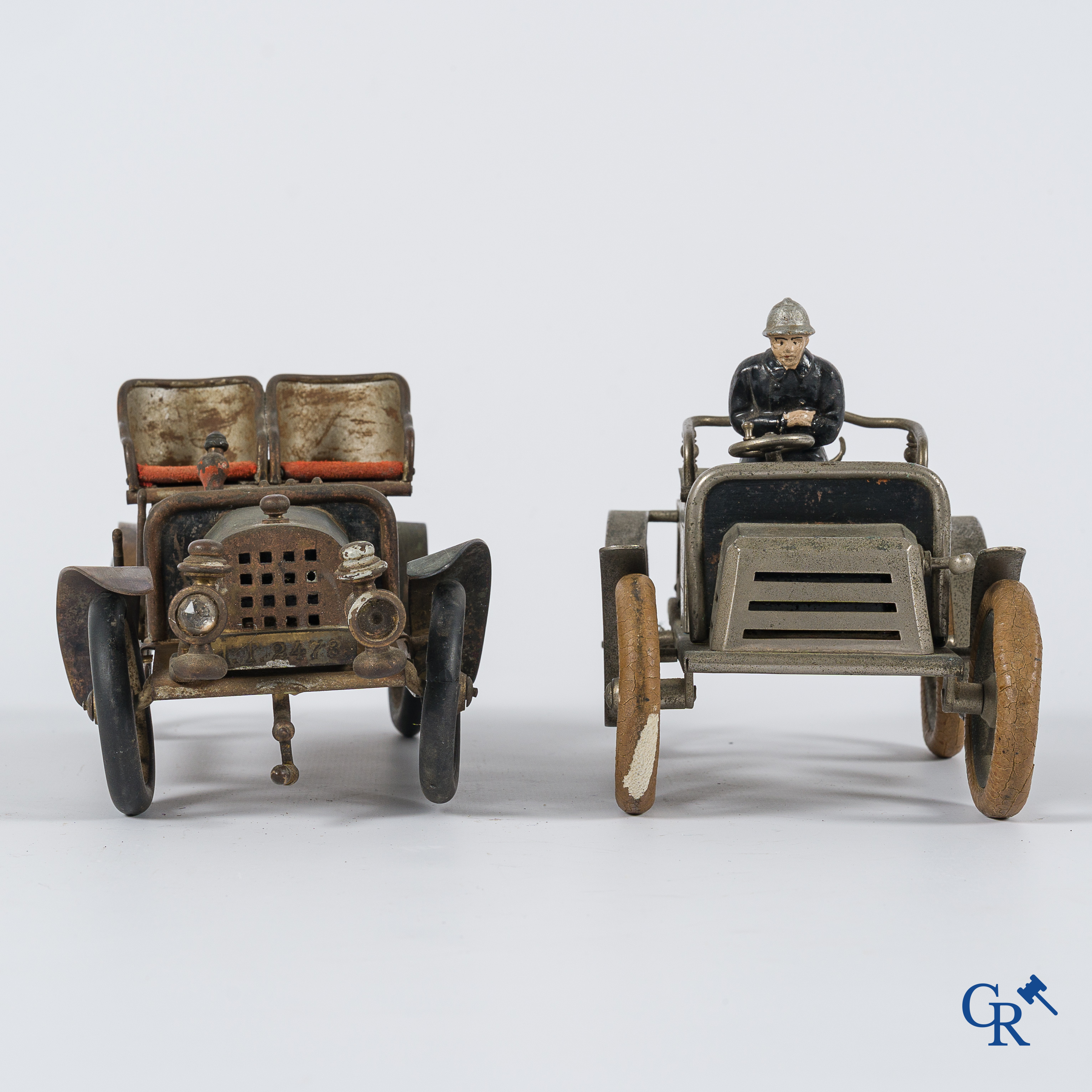 Chevob & Co. Desk set in the form of an open tourer with integrated clock and an early fire truck. Early 1900.