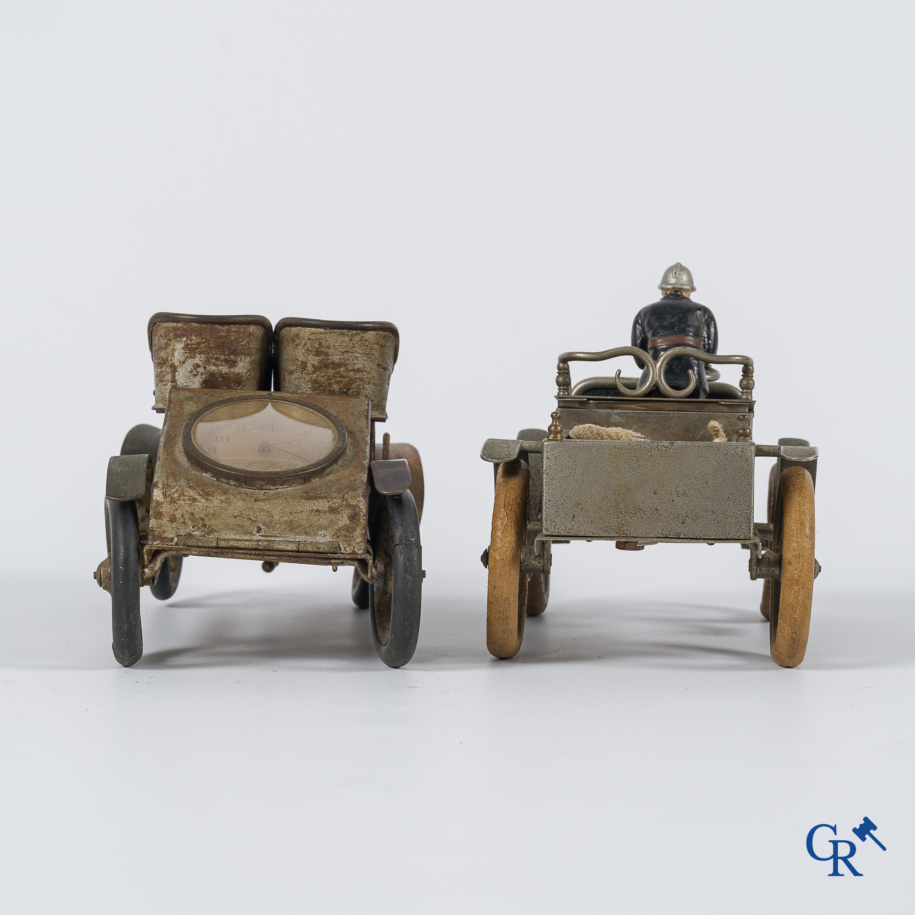 Chevob & Co. Desk set in the form of an open tourer with integrated clock and an early fire truck. Early 1900.