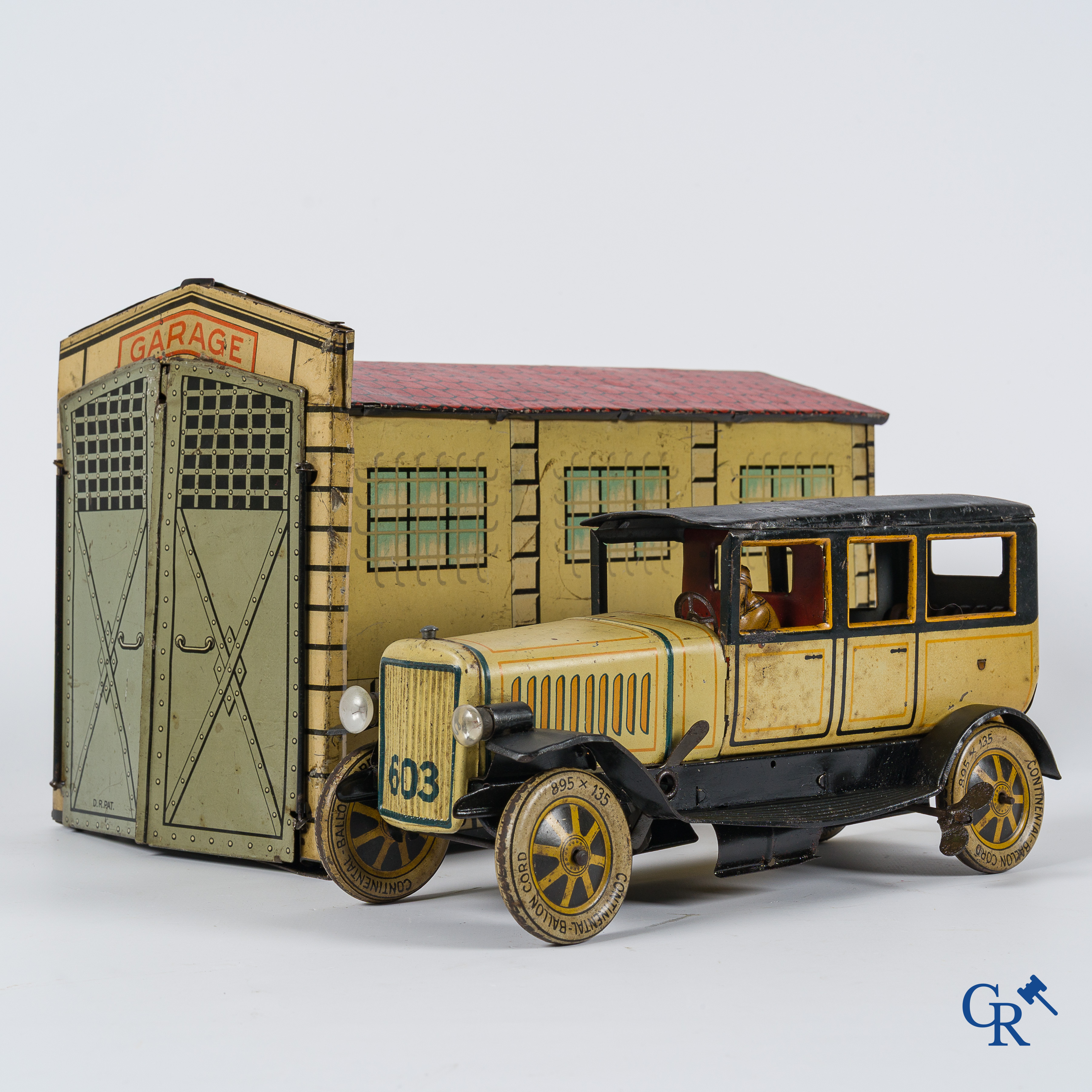 Old toys. Distler, Germany. Limousine with accompanying garage. Metal with winding mechanism. 1920's- 1930's.