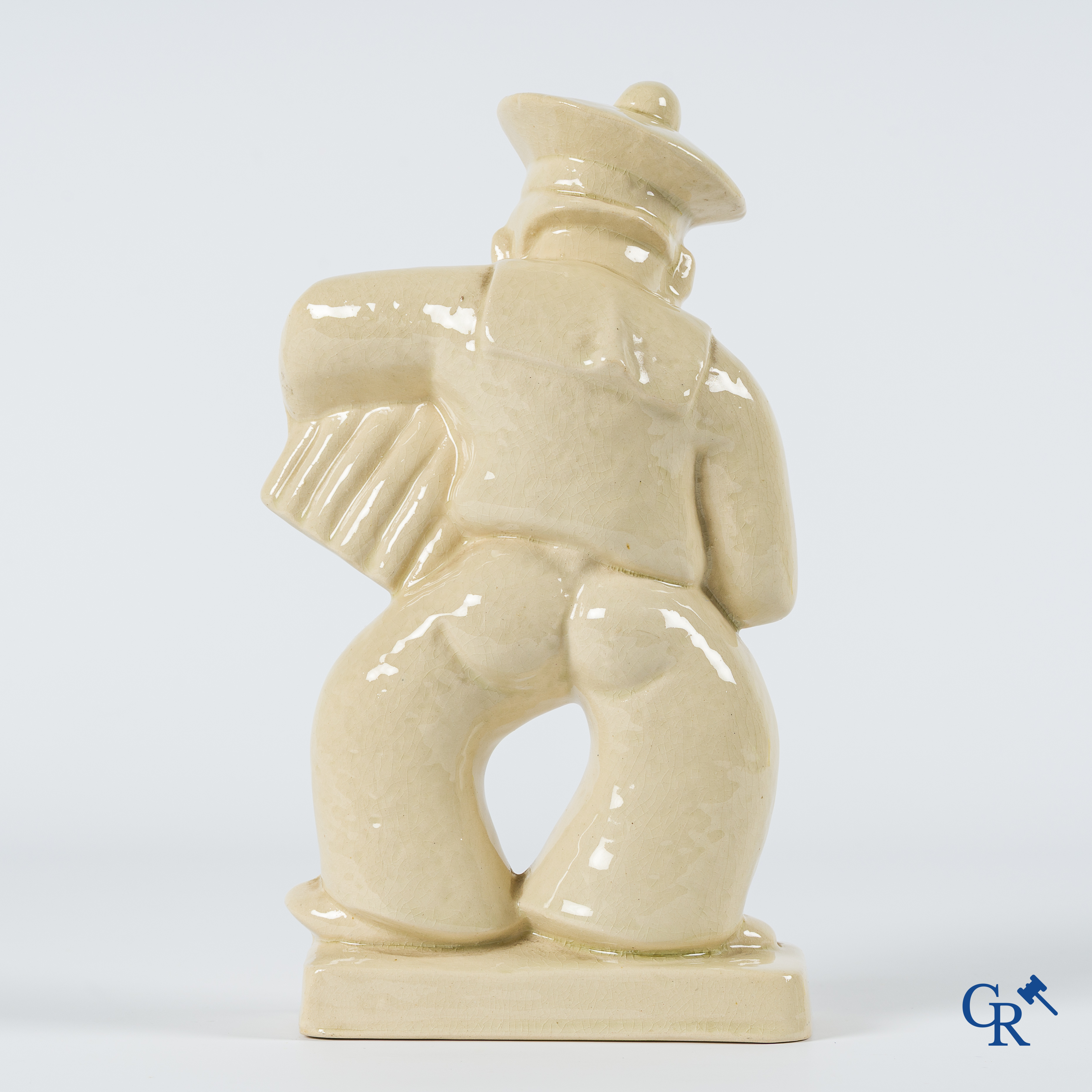 Art Deco. Sailor with accordion in typical French crackled glazed faience. Circa 1930.