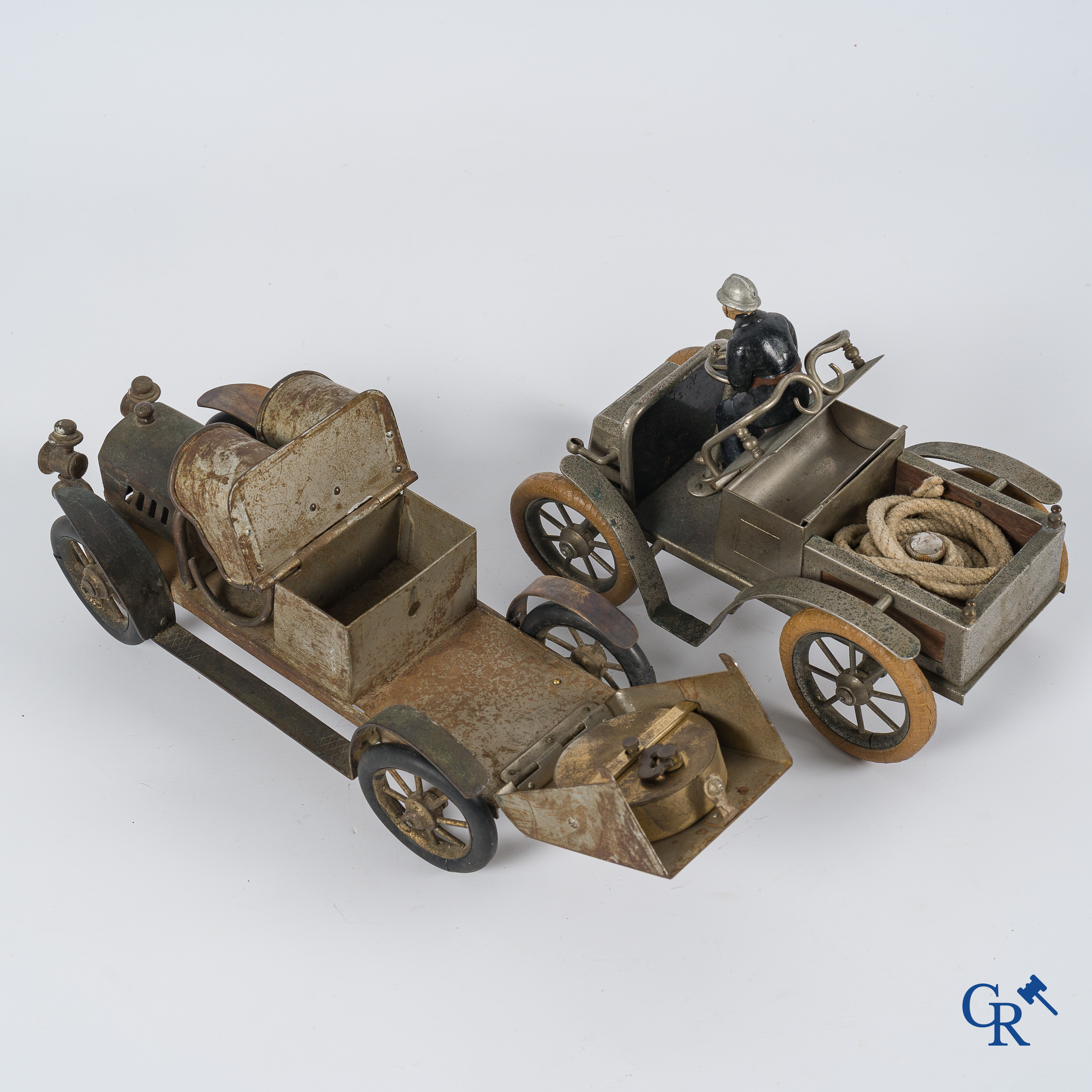 Chevob & Co. Desk set in the form of an open tourer with integrated clock and an early fire truck. Early 1900.