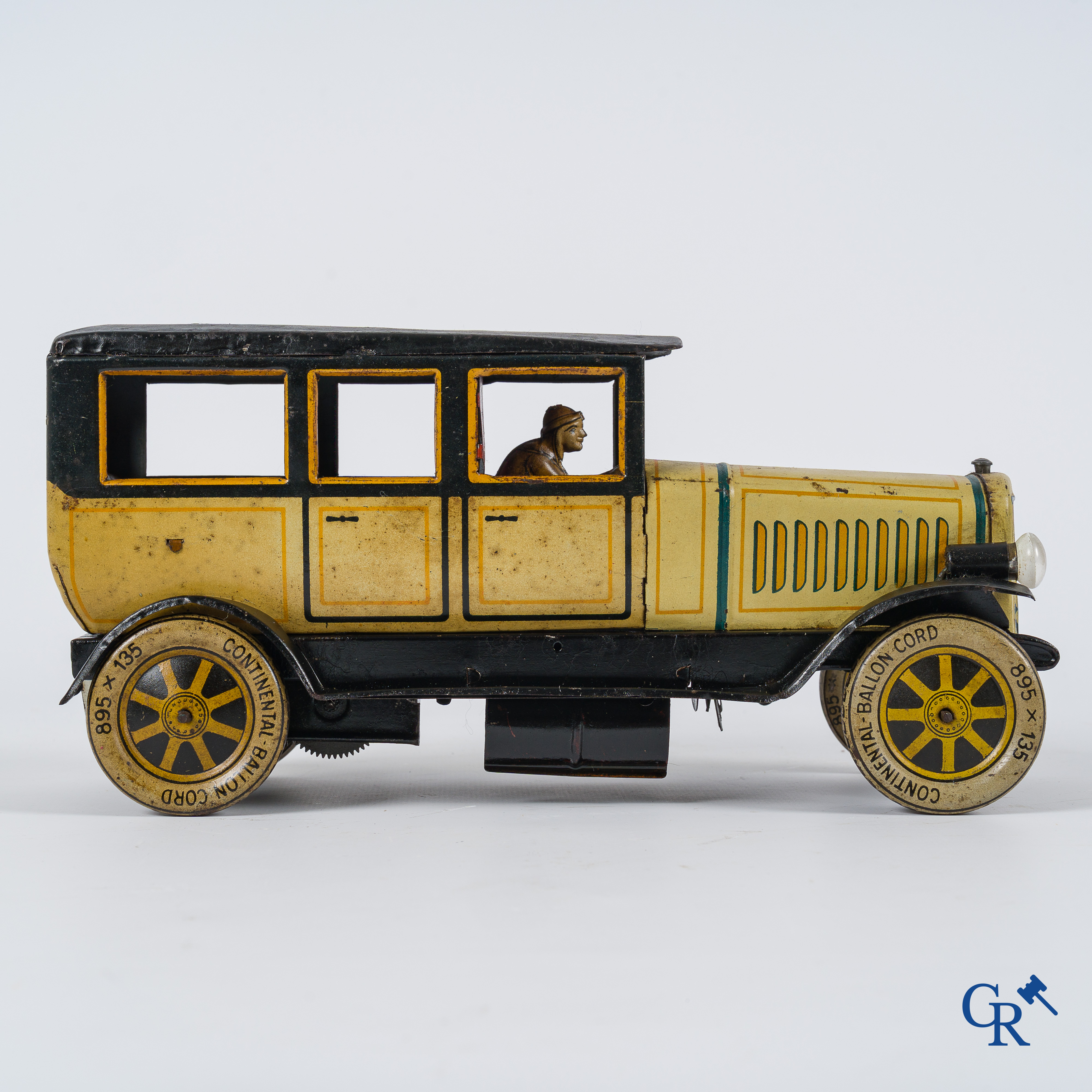 Old toys. Distler, Germany. Limousine with accompanying garage. Metal with winding mechanism. 1920's- 1930's.