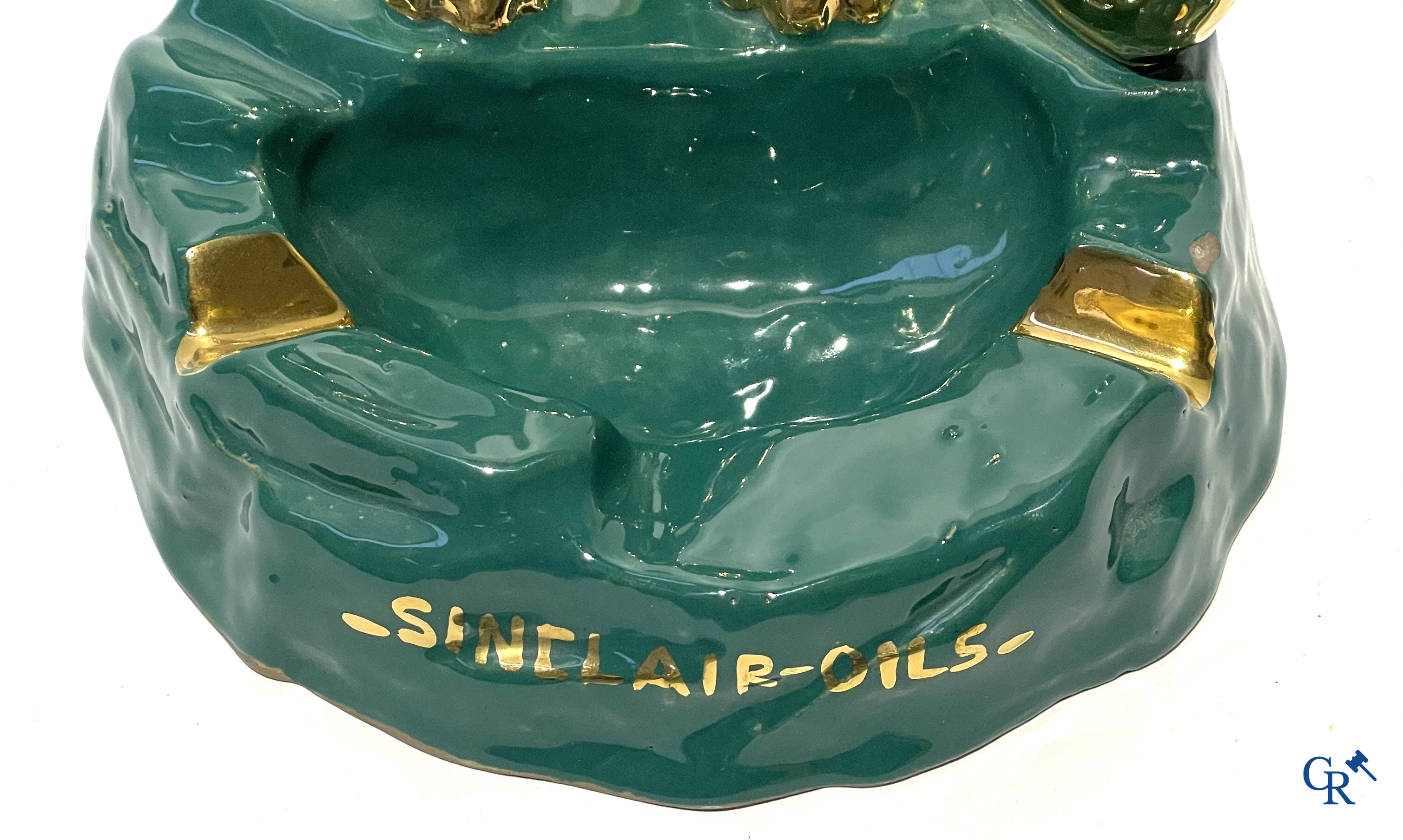 Sinclair. Publicity ashtray with a dinosaur in enamelled faience for the Sinclair Oil Corporation. 1950's.