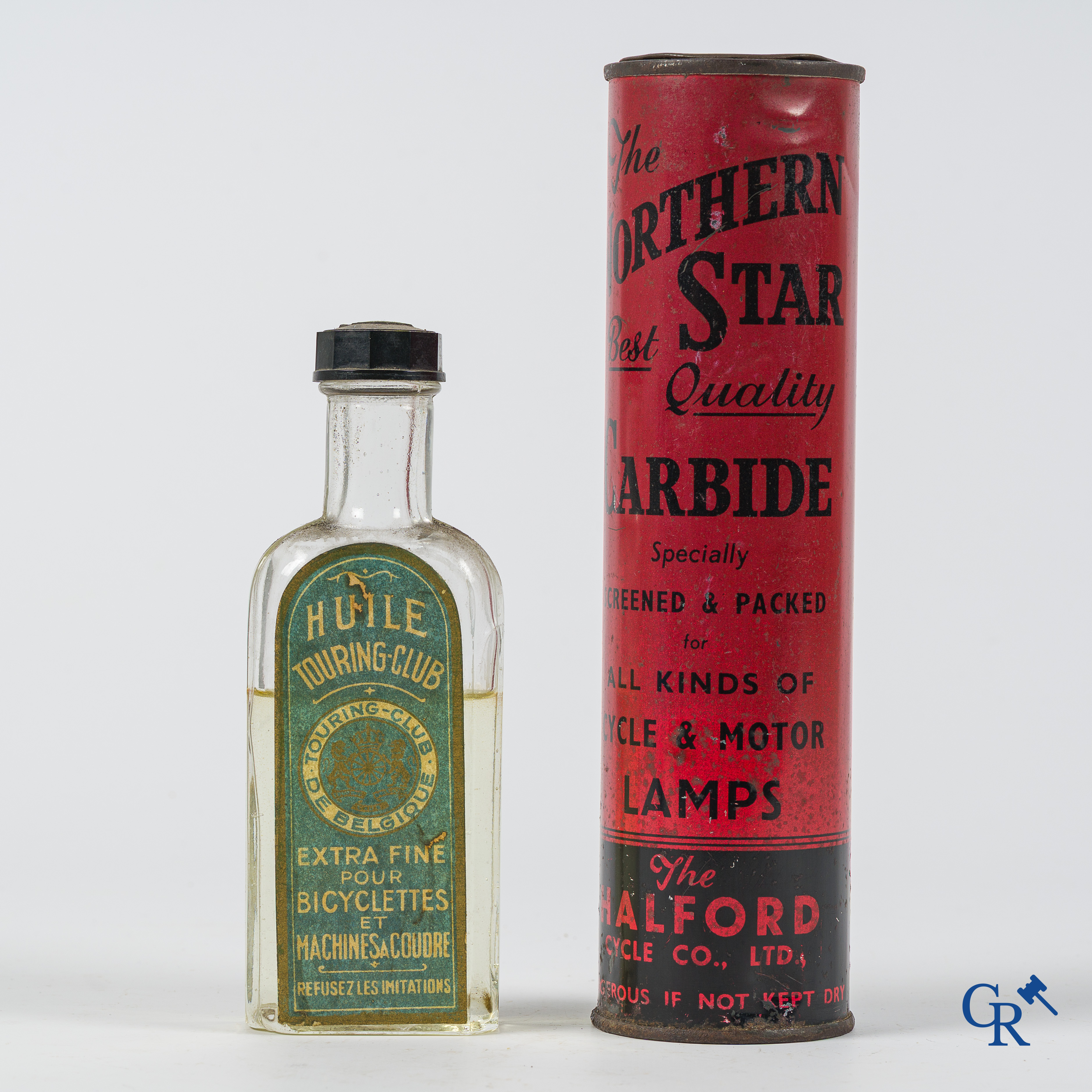 The Northern Star. Carbide tin for bike and motorcycle lighting and a glass Touring Club oil bottle. 1920's - 1930's.