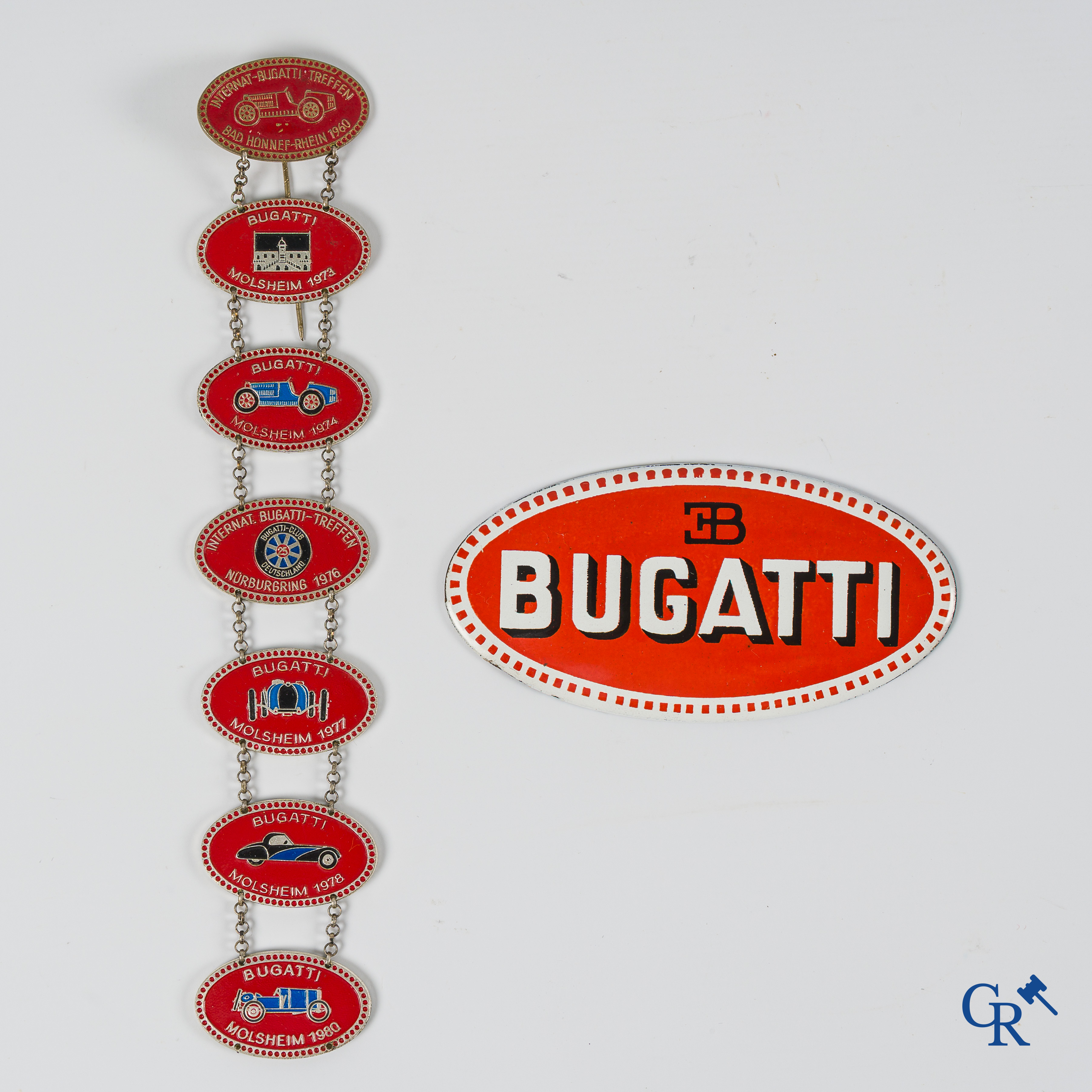 Automobilia. Bugatti "macaron" or grille sign in enamelled metal and several Bugatti meeting souvenirs.