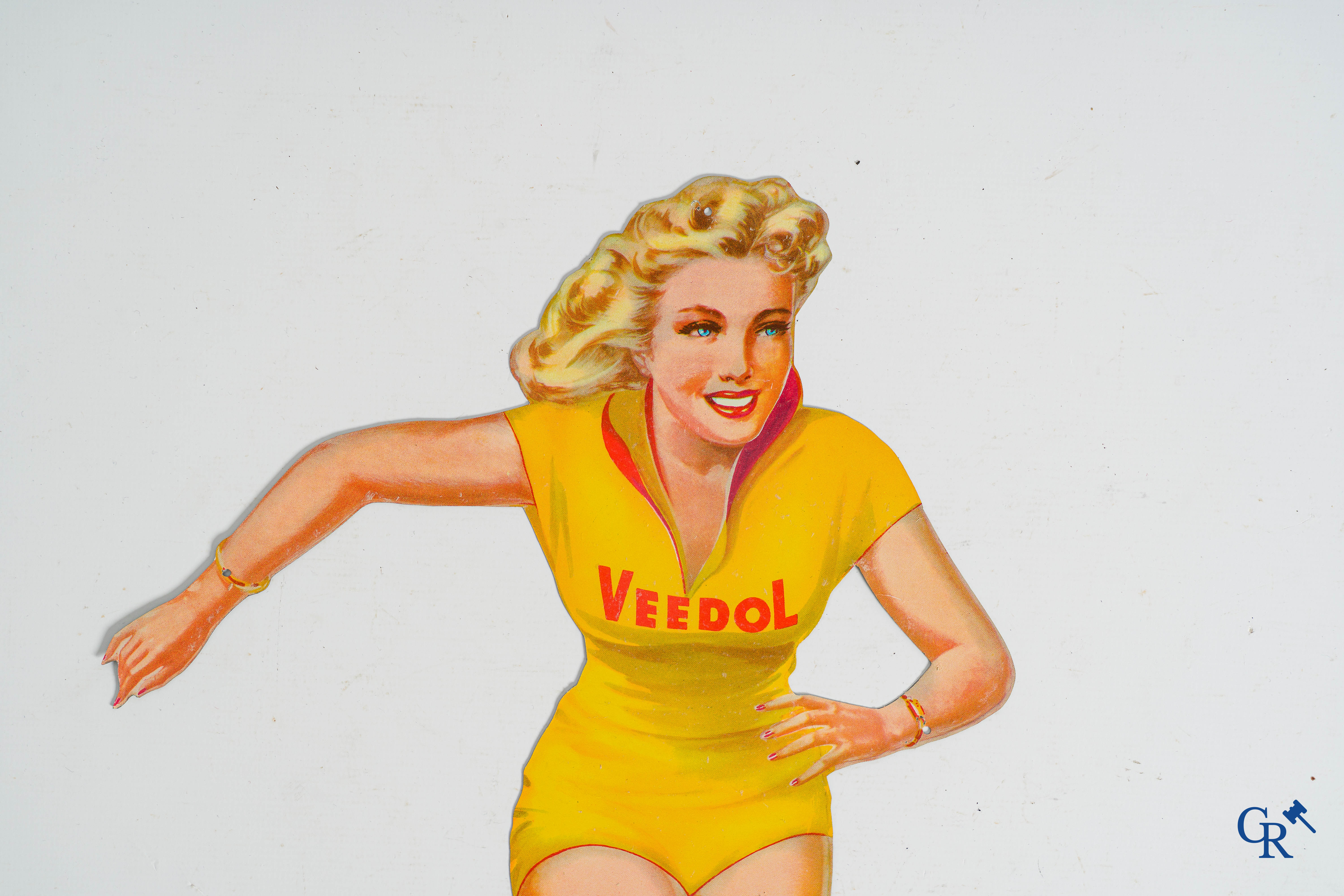 Veedol. Original Pin up or "Ice Skating girl" in metal. Publicity for Veedol motor oil. 1950's-1960's.