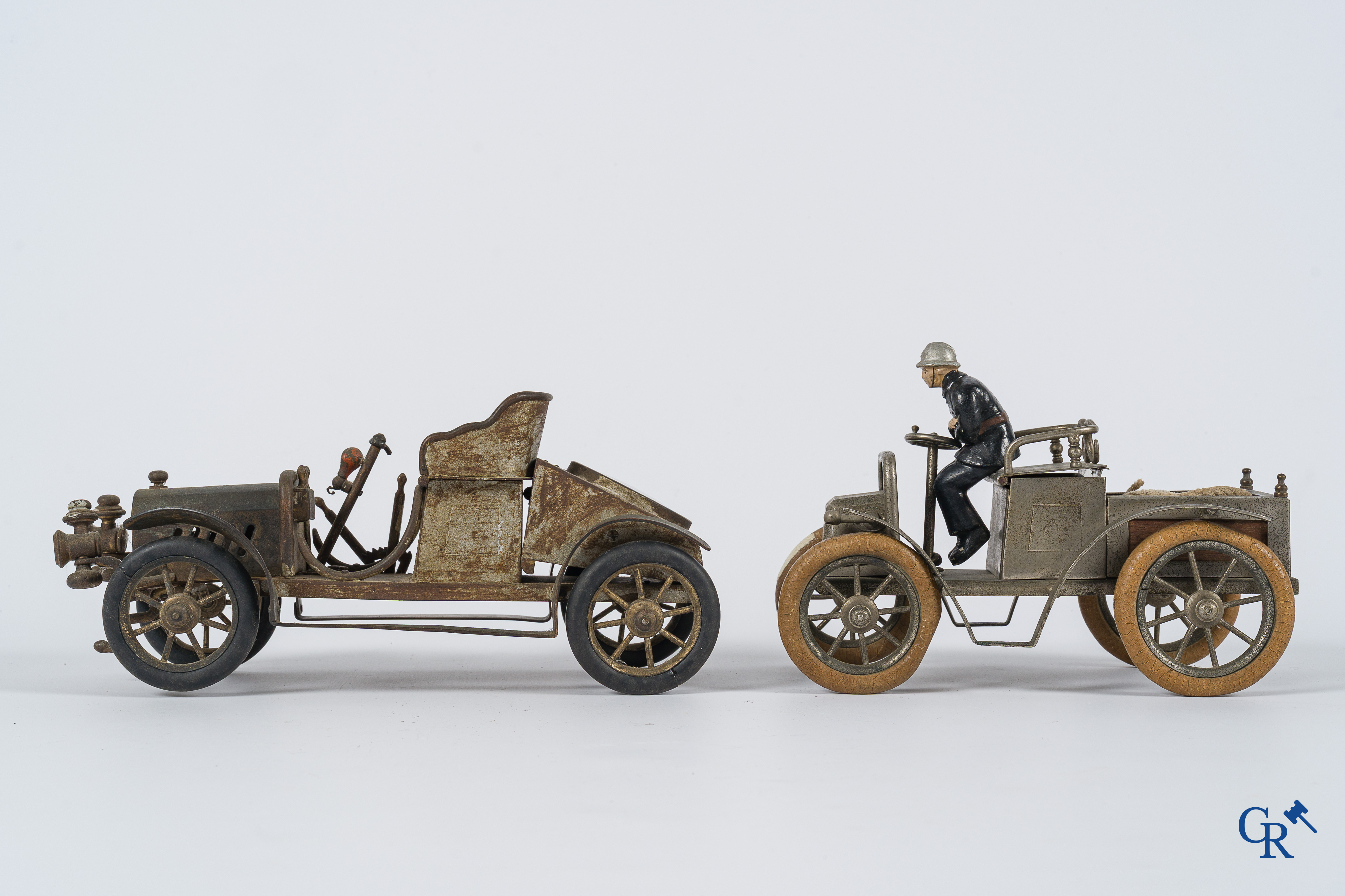 Chevob & Co. Desk set in the form of an open tourer with integrated clock and an early fire truck. Early 1900.