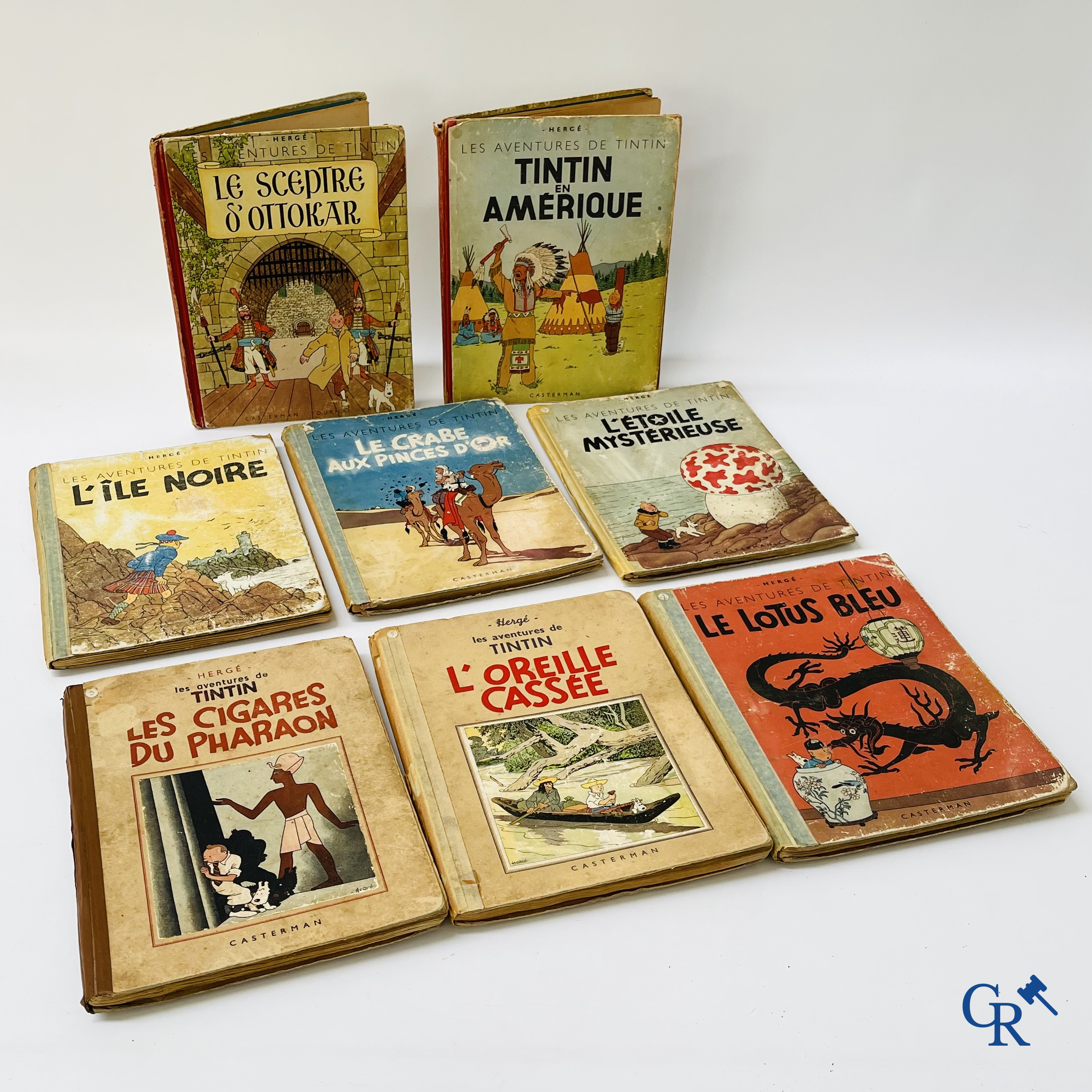Hergé. 8 old Tintin albums including prints in black and white.