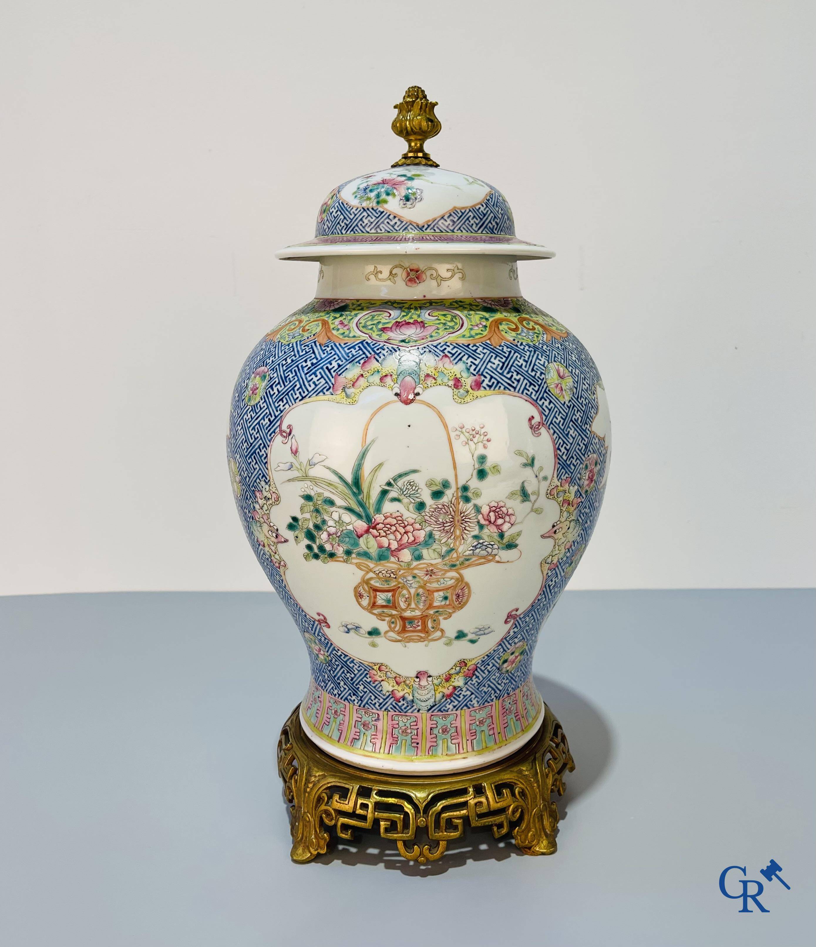 Asian Art, Chinese porcelain, a finely decorated Chinese famille rose vase with bronze. 19th century.