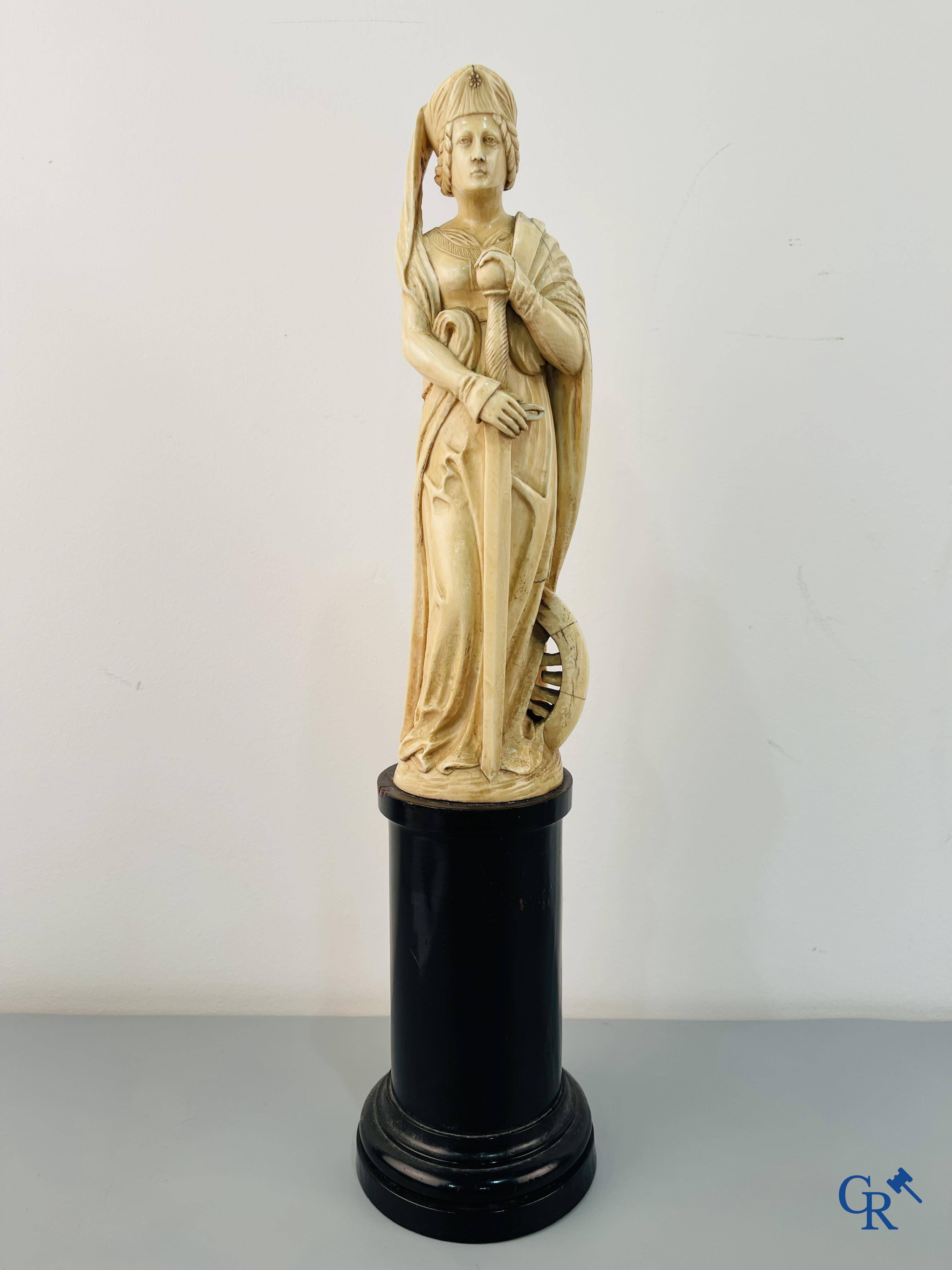 Dieppe, French work, early 19th century. Representation of Catherine of Alexandria in ivory on a pedestal.