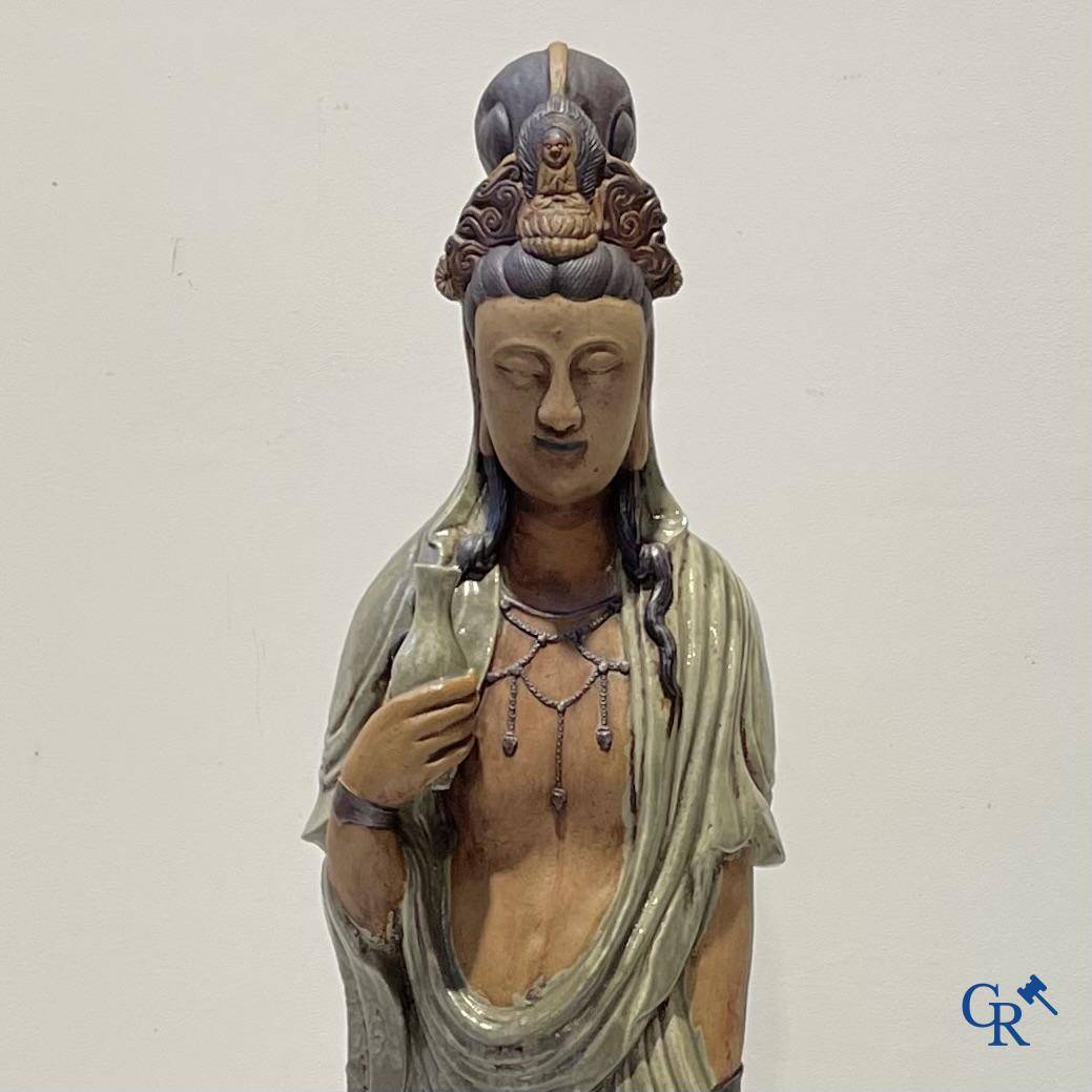 Asian Art, an imposing Shiwan earthenware figure of Guanyin.