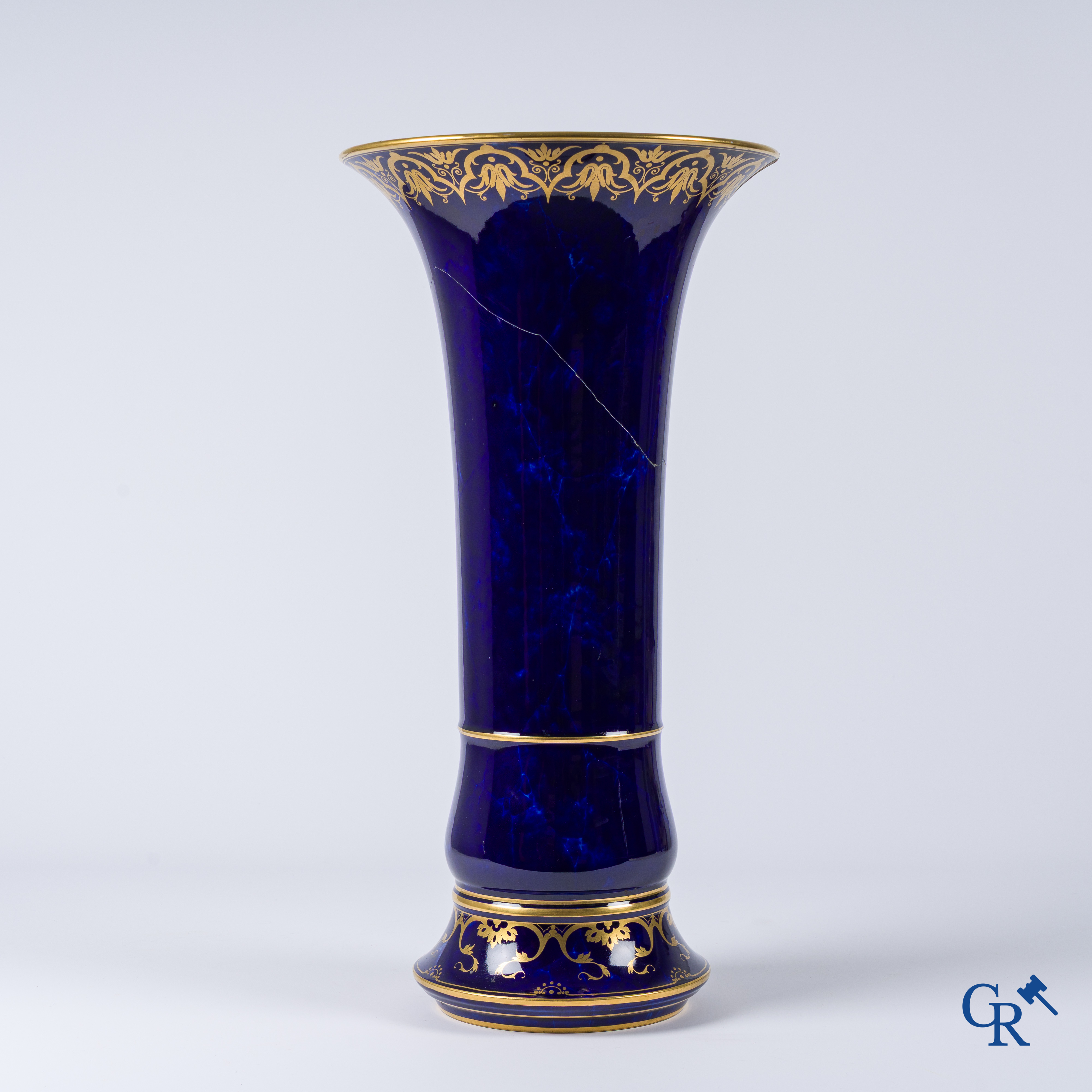 Manufacture Nationale de Sèvres. important vase with a gilded decor on a blue background colour.